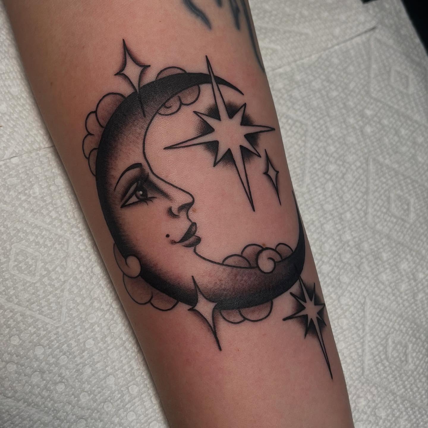 Moon and star black and grey tattoo on the forearm by Kayla Faircloth, Charlotte, North Carolina