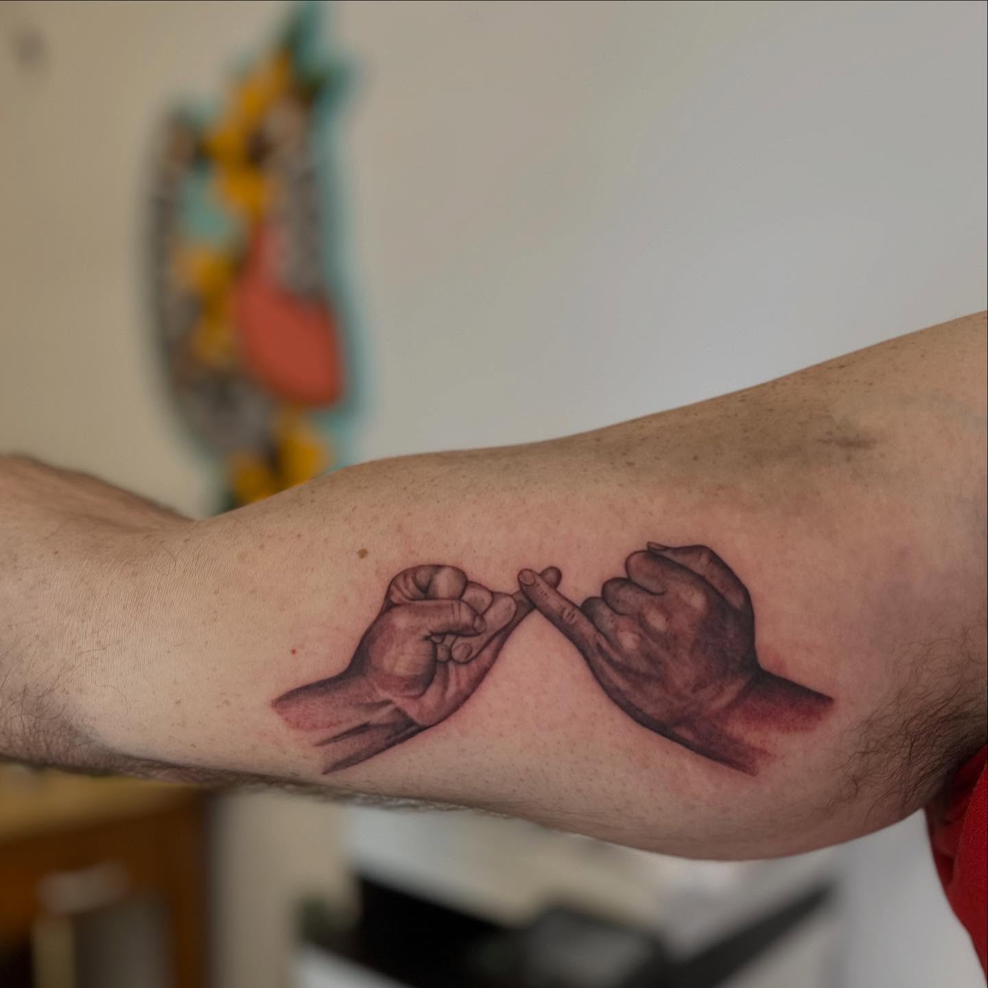 Hands touching realism tattoo on the forearm by Abigail Townsend