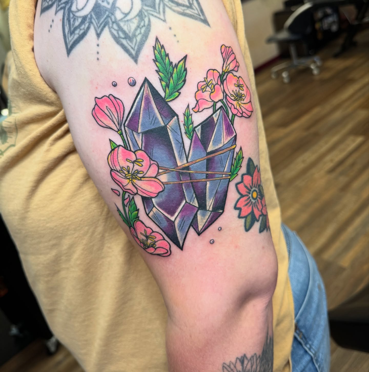 Crystal and flowers geometric tattoo on the forearm by Erin Moore
