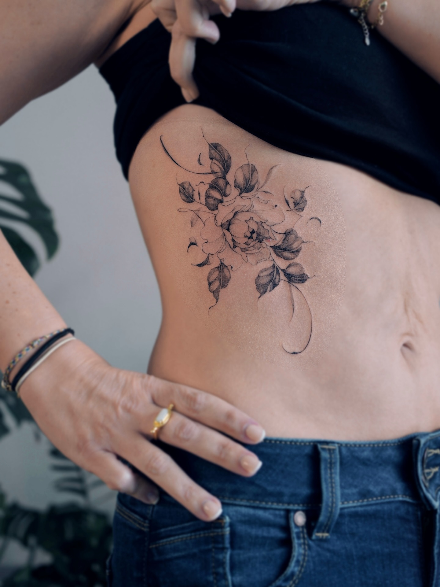 Floral bouquet black and grey tattoo on the ribs by Yeonji