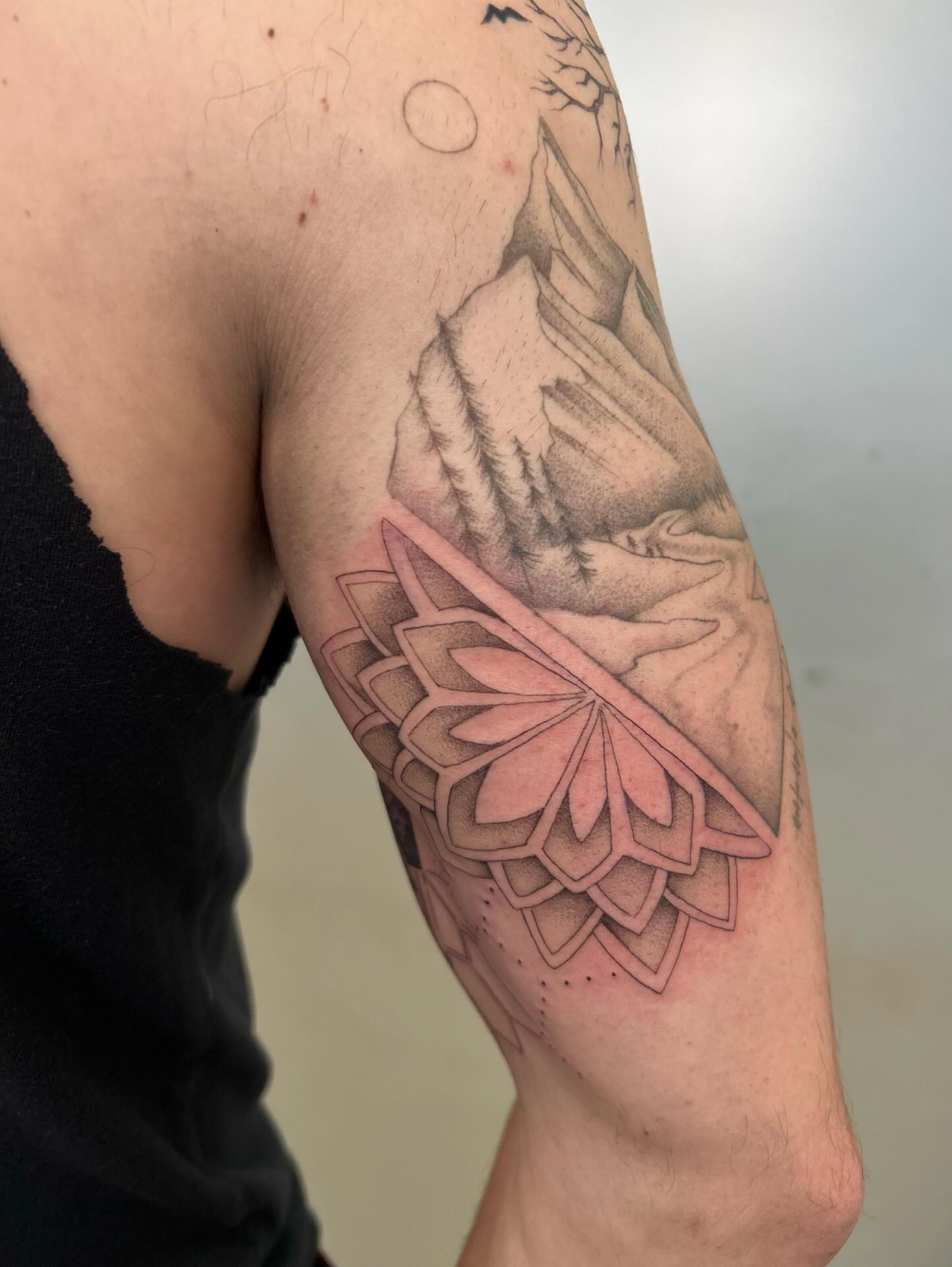 Lotus flower geometric tattoo on the forearm by Olivia Fox