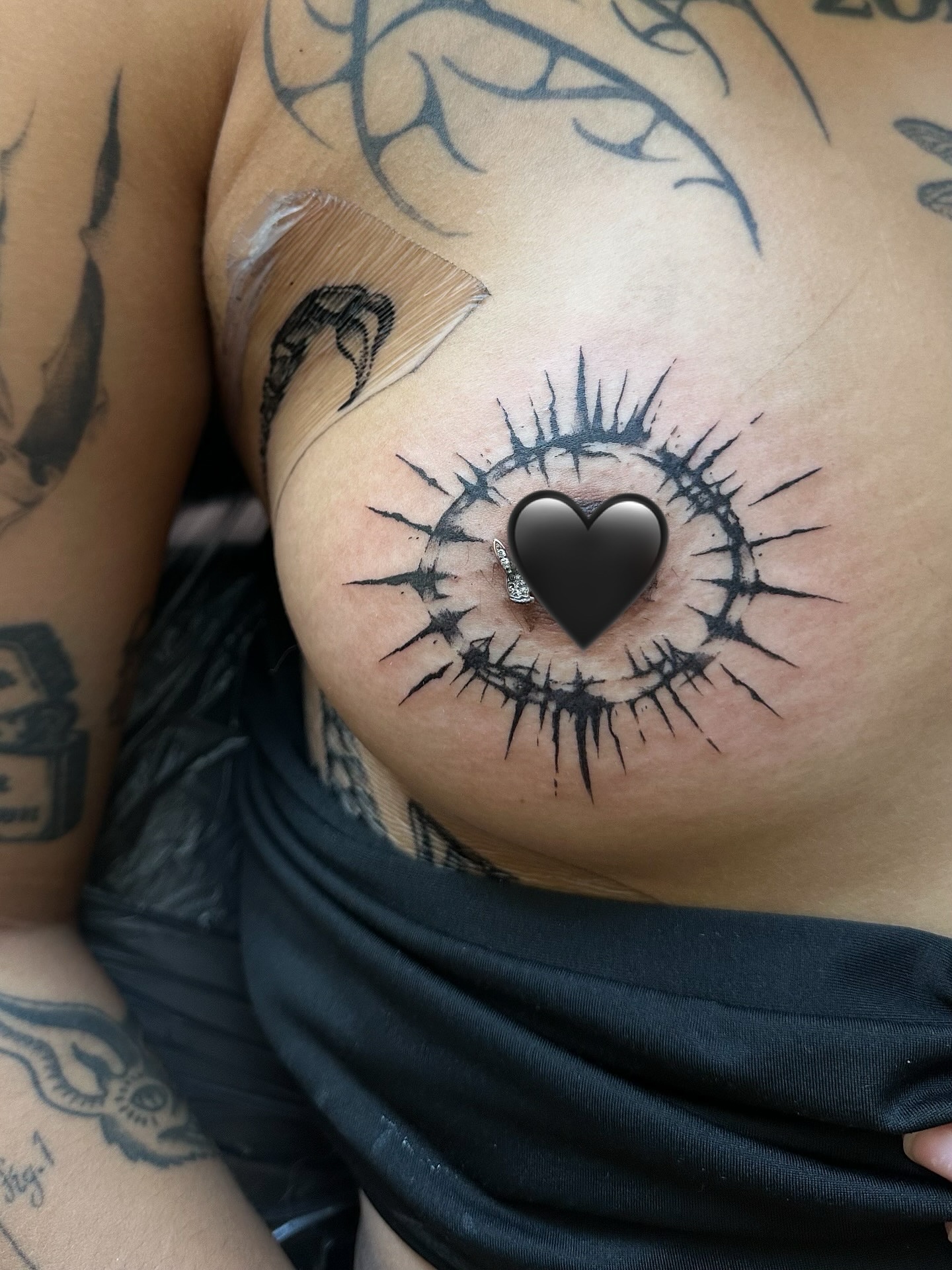 Eye with heart realism tattoo on the chest by Casper Tattoos Toronto
