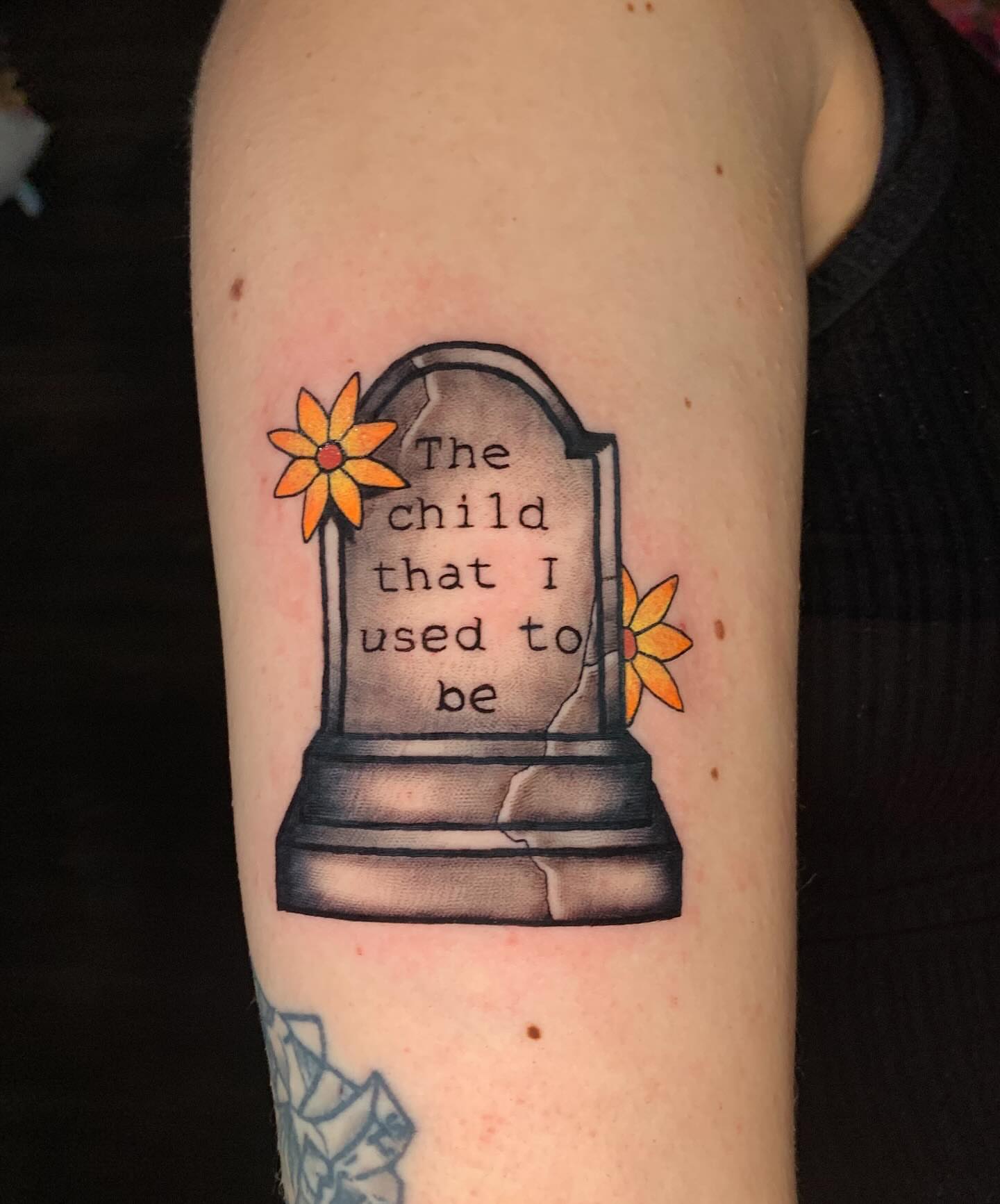 Grave marker black and grey tattoo on the forearm by Devon