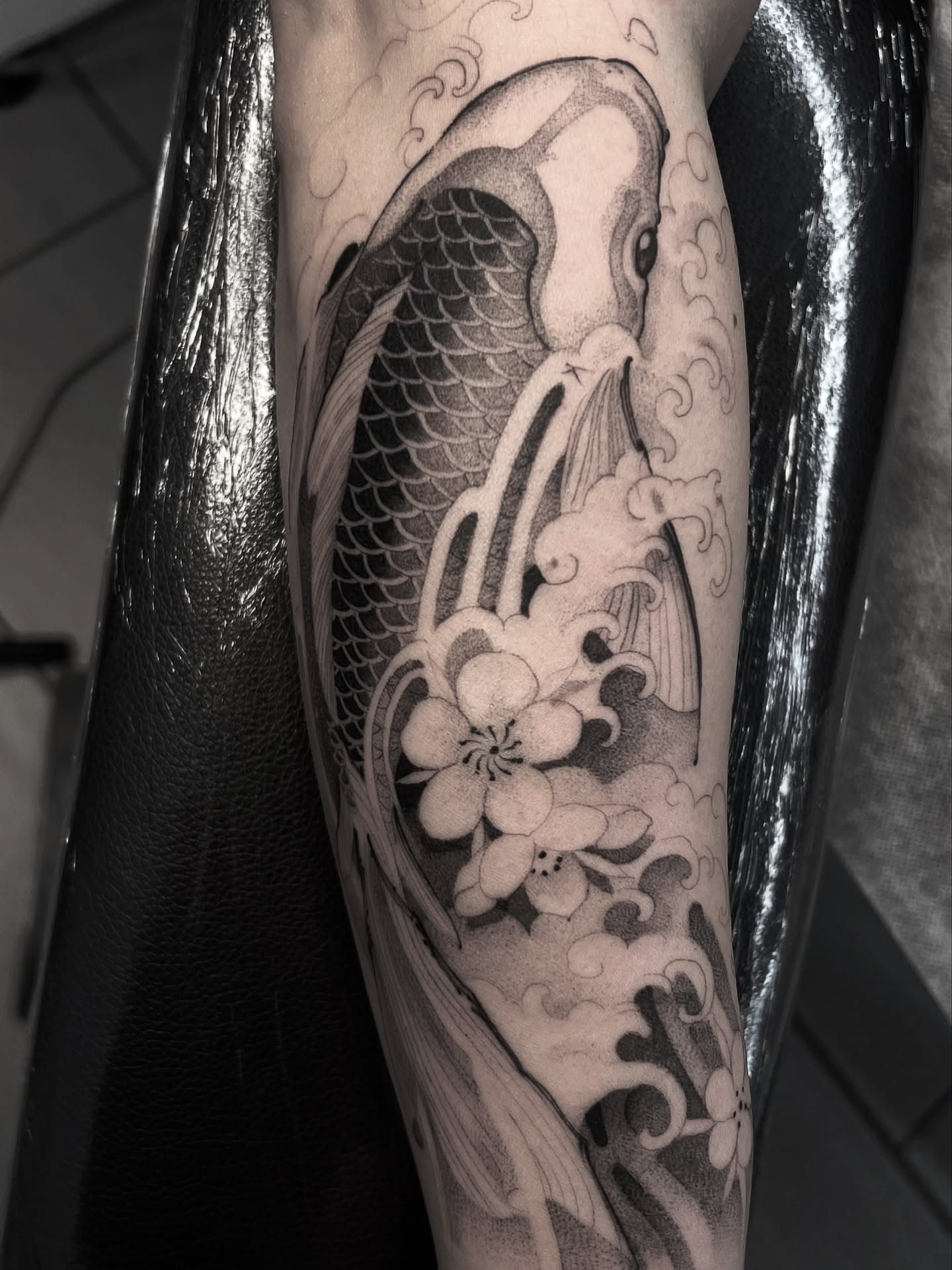 Koi fish and cherry blossoms japanese irezumi tattoo on the forearm by Joshua Hung, Alhambra, California