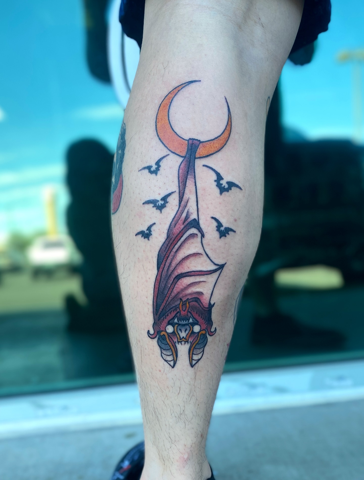 Bat and crescent moon neo-traditional tattoo on the forearm by Elliot Jaye Valentine