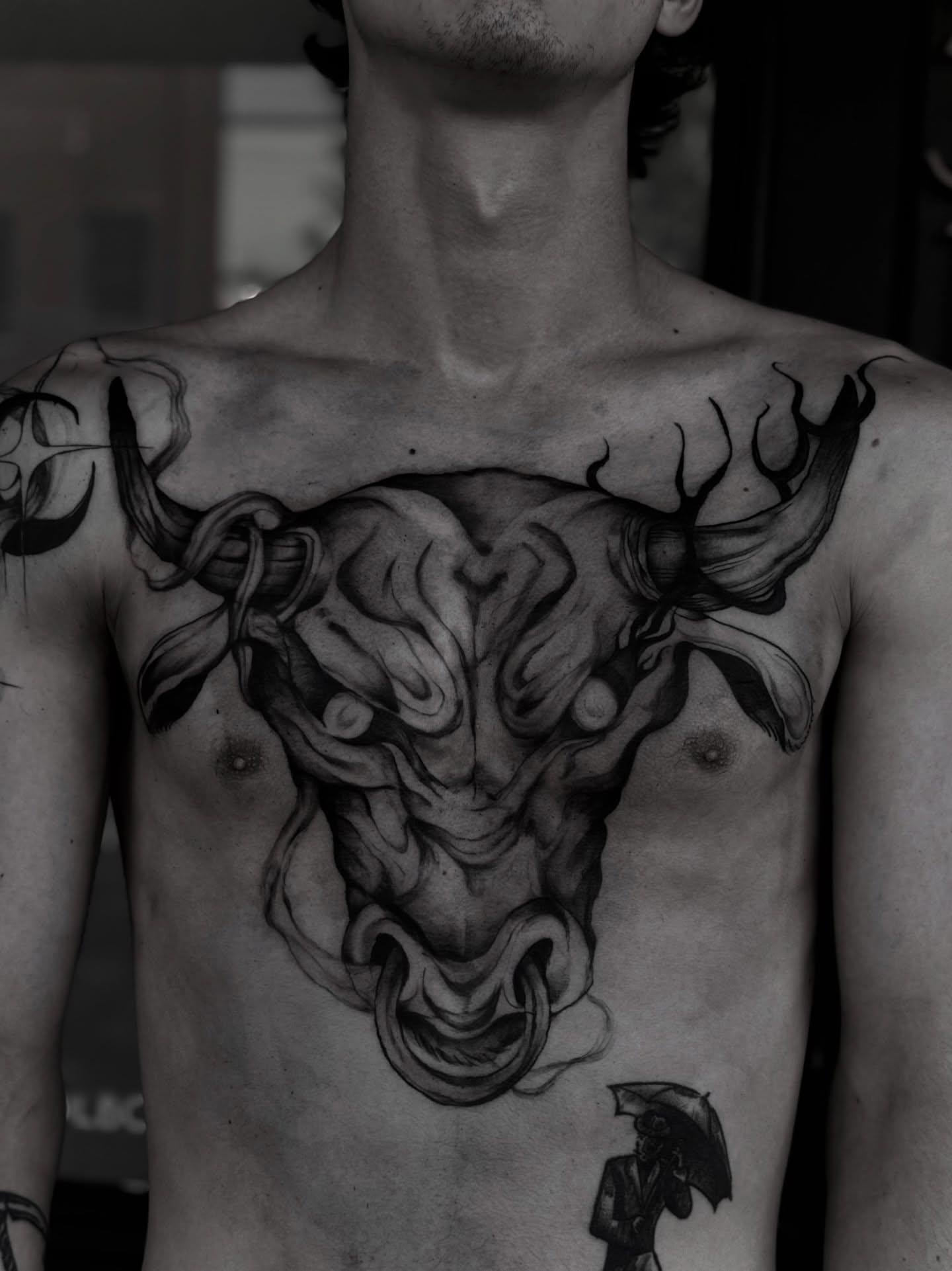 Bull head black and grey tattoo on the chest by 𝙹𝙰𝚉𝚉 𝙲𝙷𝙰𝙾