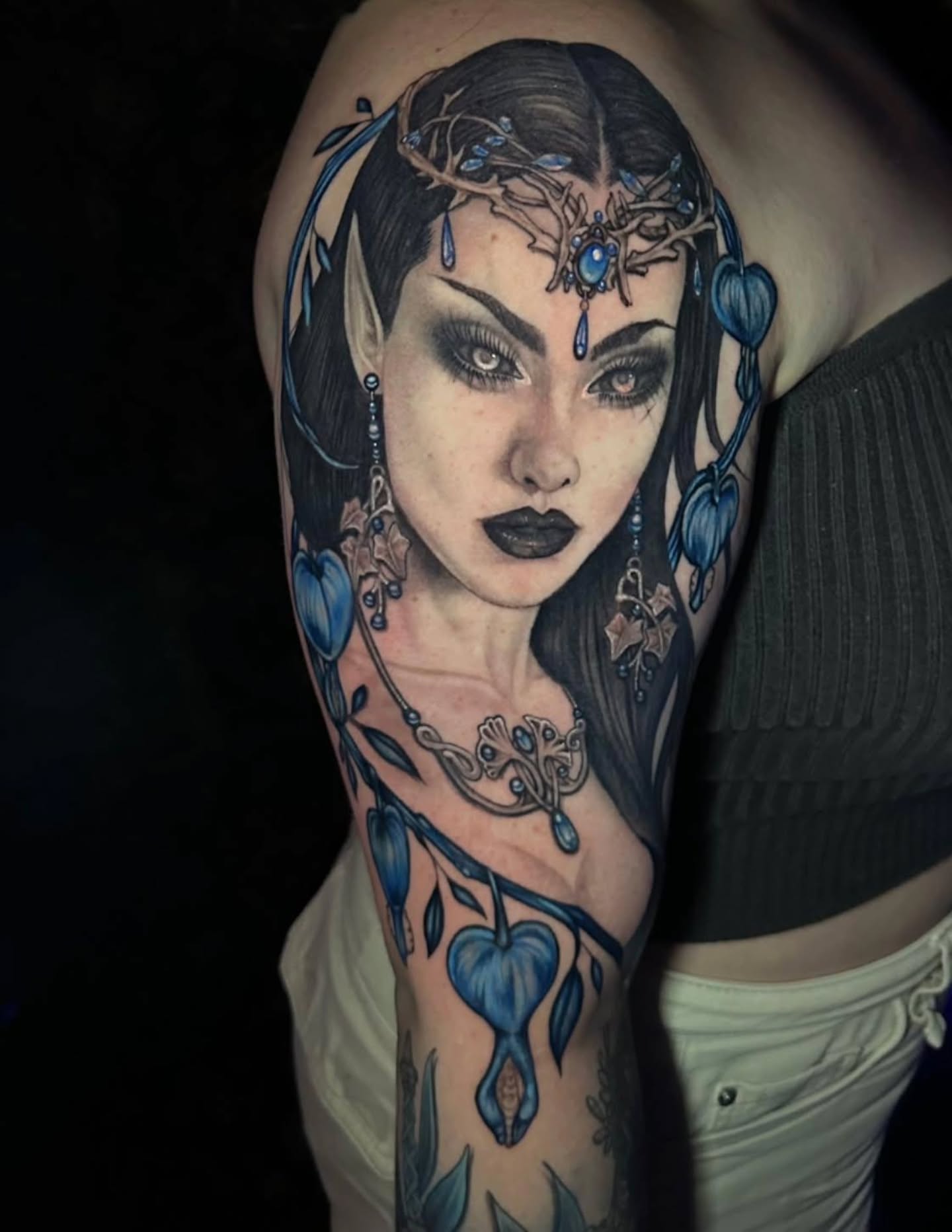 Elf-like woman dark realism tattoo on the shoulder by 𝕸𝖊𝖌𝖆𝖓 𝕮𝖍𝖊𝖛𝖆𝖙𝖊𝖜𝖆🦇 Brooklyn Tattoo Artist
