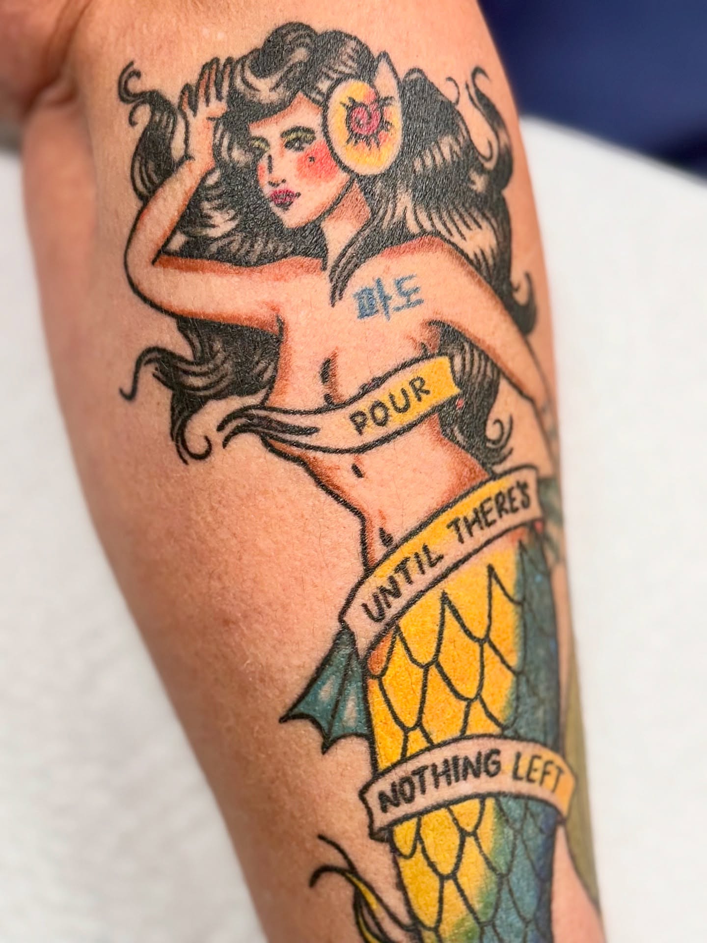 Mermaid American traditional tattoo on the forearm by Sophie McTear