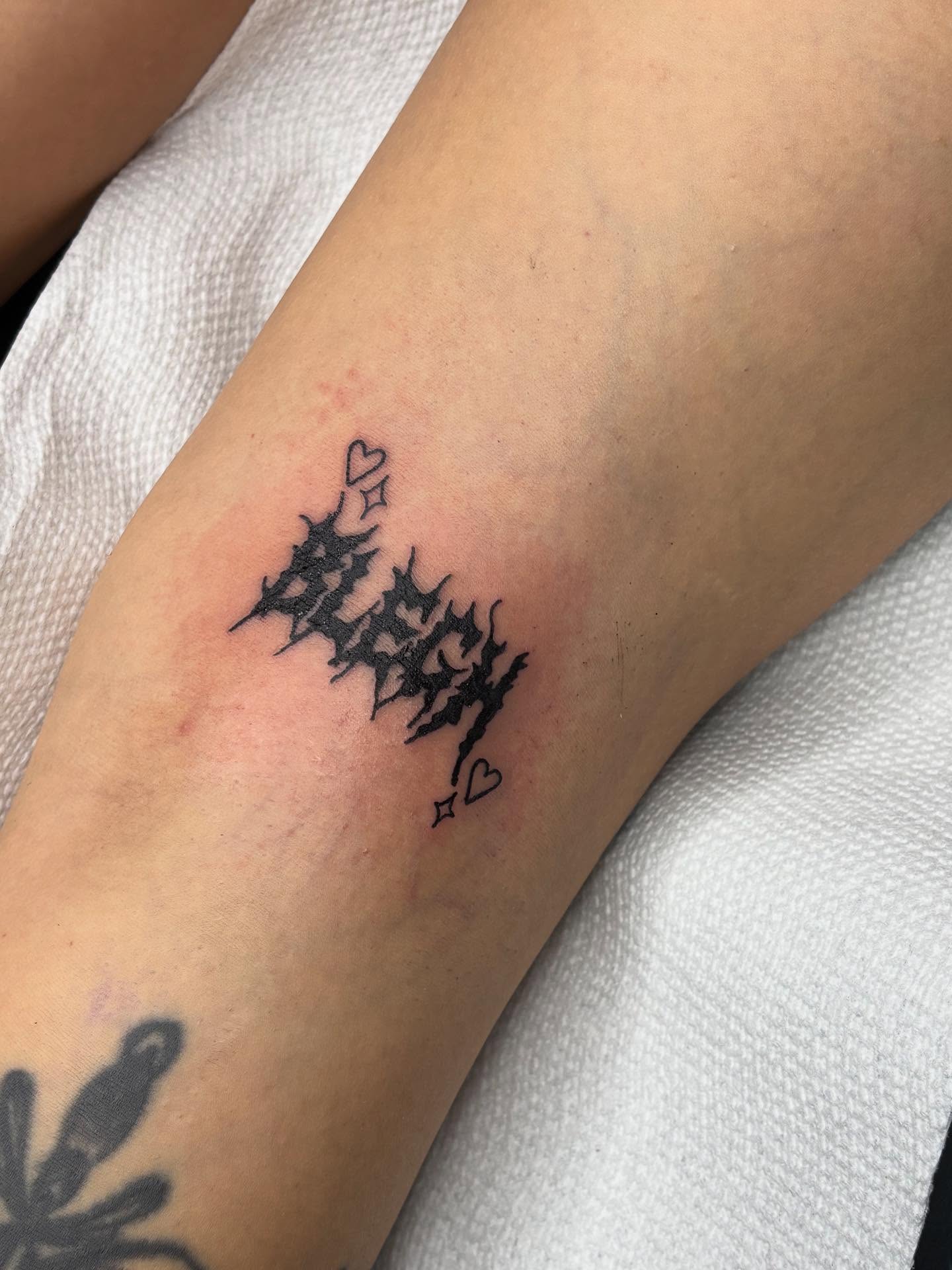 Abstract design black and grey tattoo on the forearm by kylie