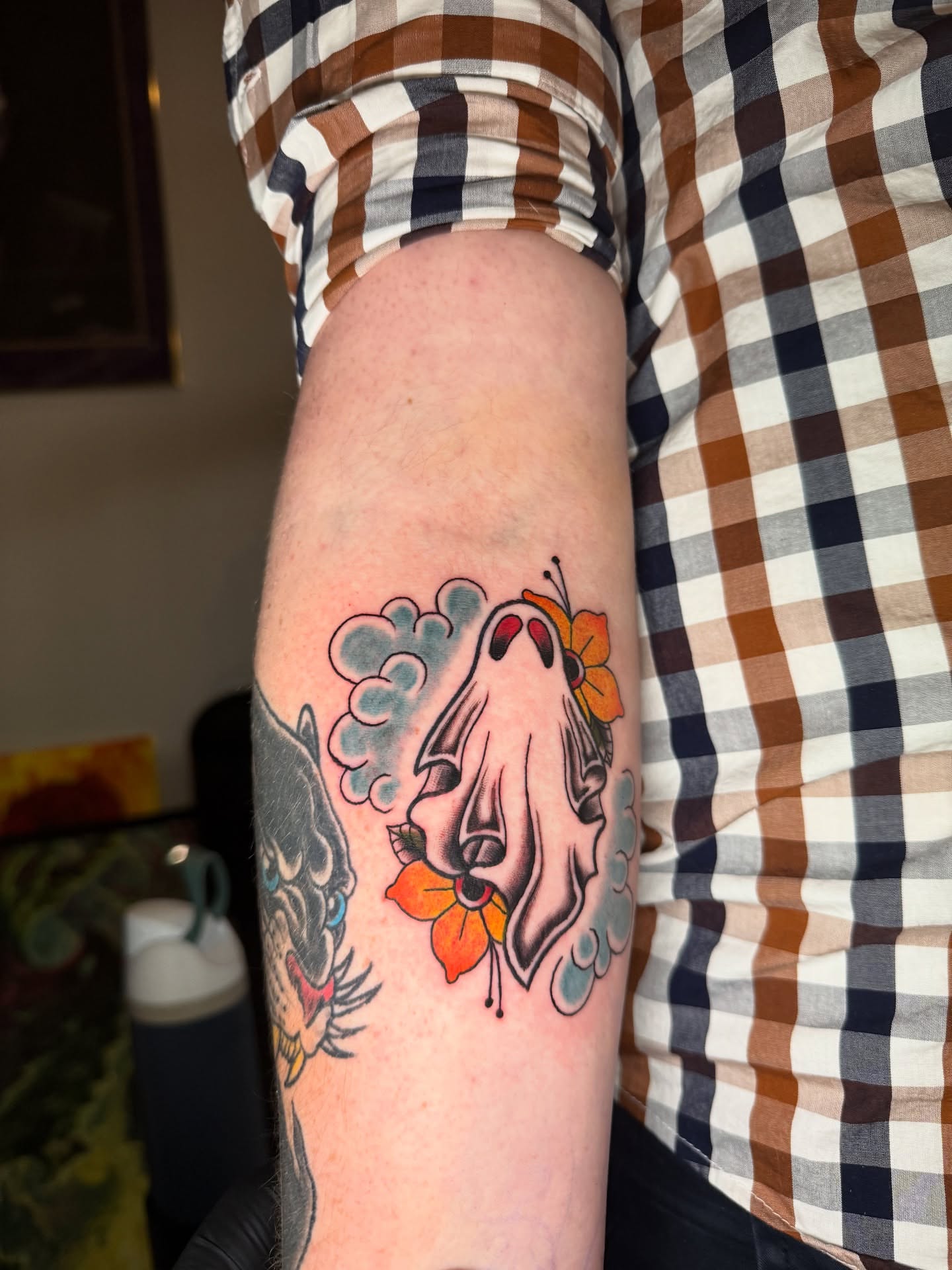 Ghost with flowers American traditional tattoo on the forearm by Austin Poliszuk, Minneapolis, Minnesota