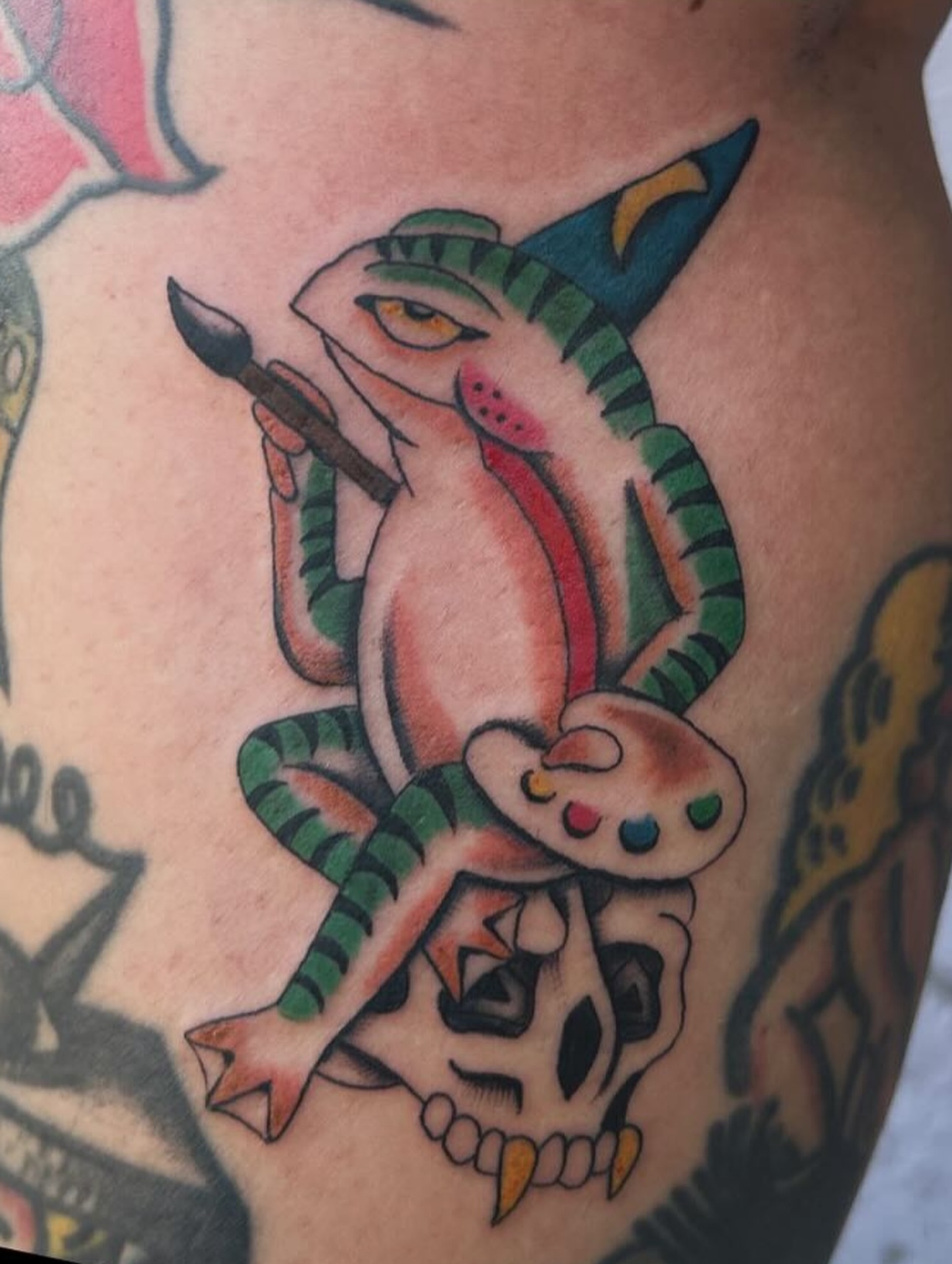 Dragon painting American traditional tattoo on the thigh by julian solis, Houston, Texas