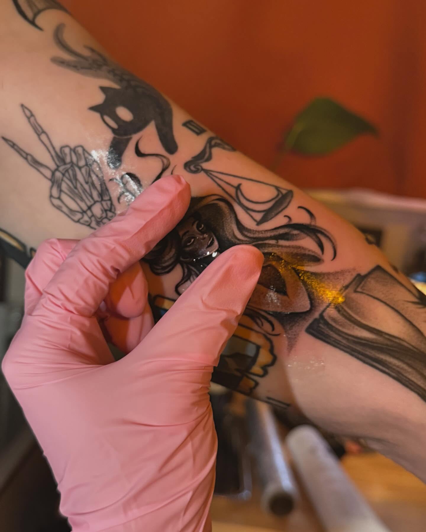 Woman with long hair neo-traditional tattoo on the forearm by laura baldwin