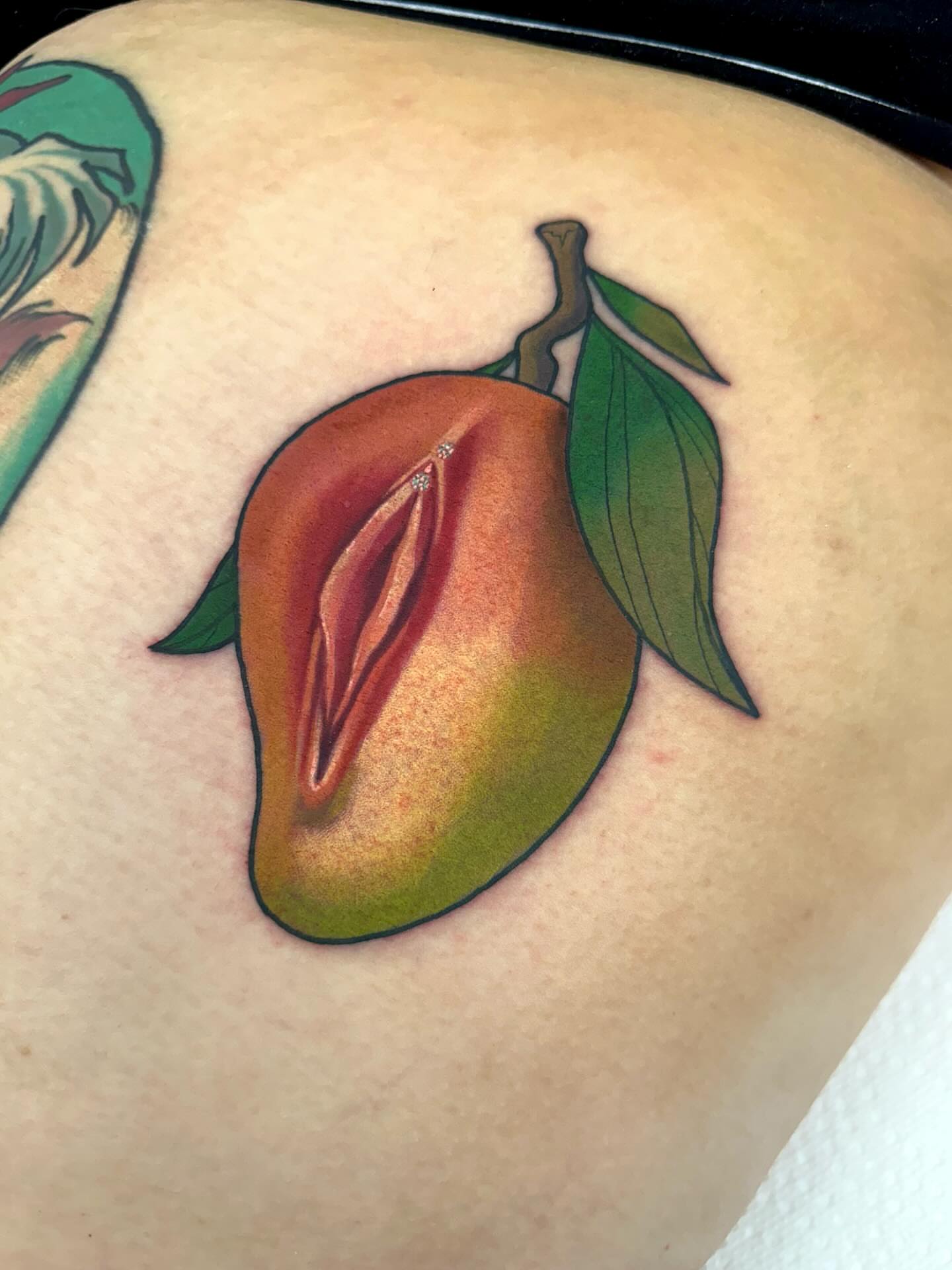 Peach realism tattoo on the shoulder by Katie Kelley