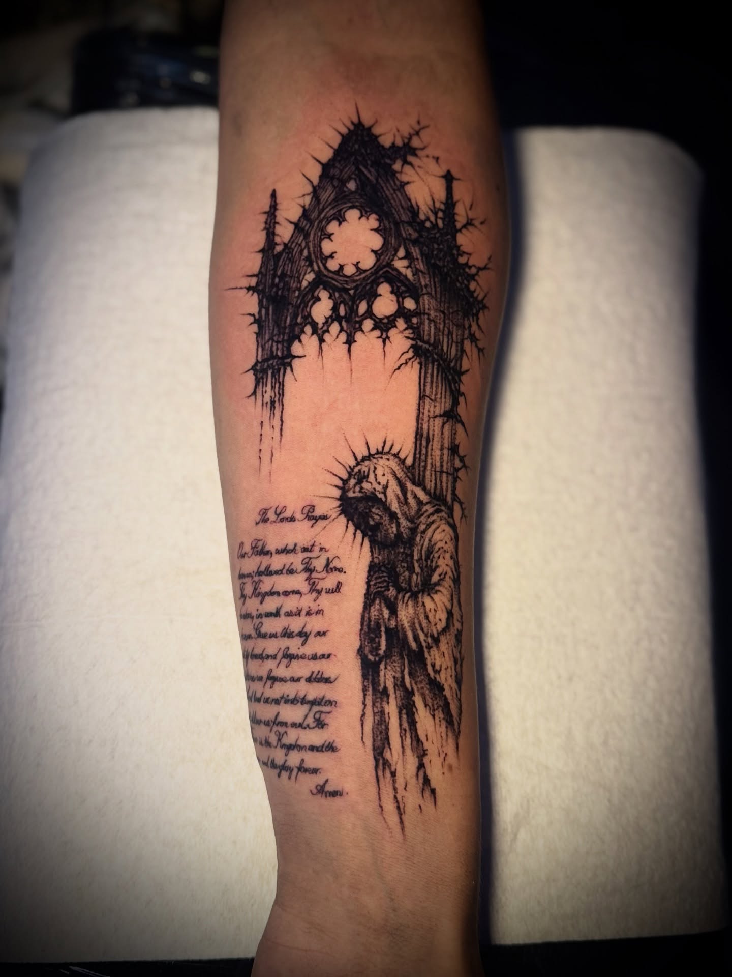 The lord's prayer dark realism tattoo on the forearm by Tattoo Artist based in Dallas Tx