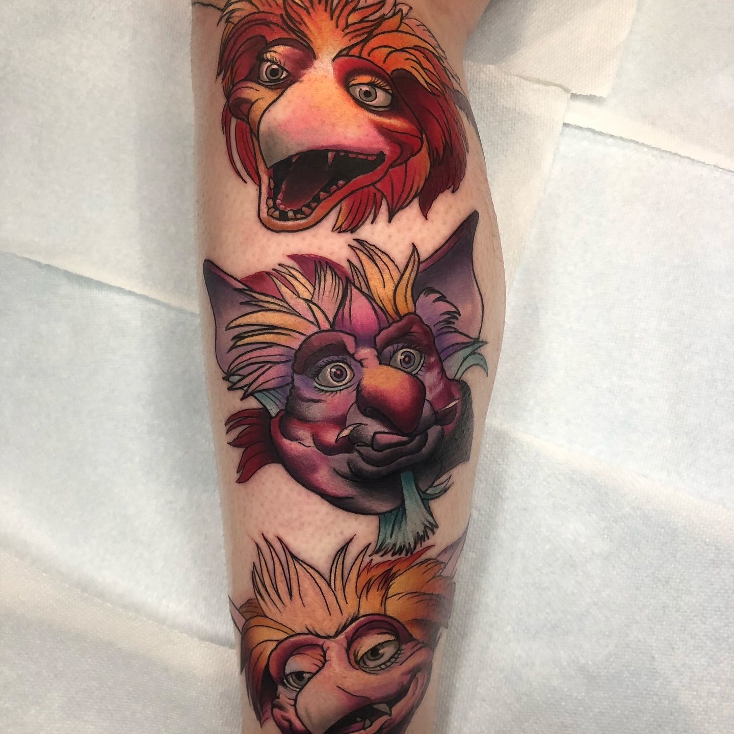 Lion heads realism tattoo on the forearm by Emily Walker
