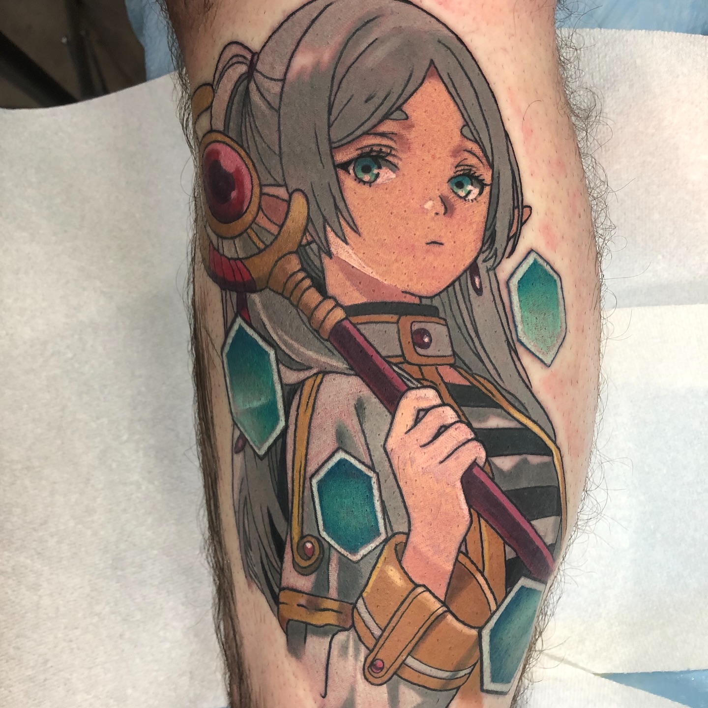 Anime character anime tattoo on the forearm by Emily Walker