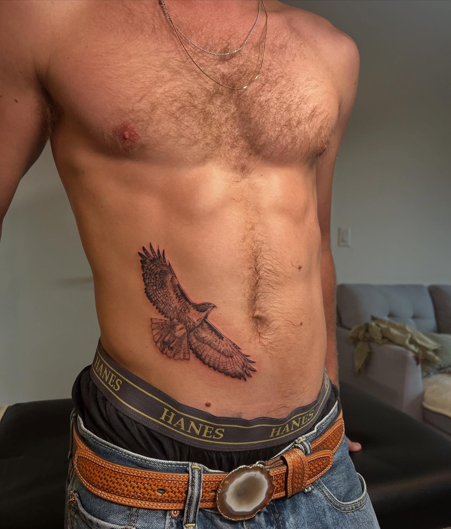 Hawk realism tattoo on the ribs by sarah bug