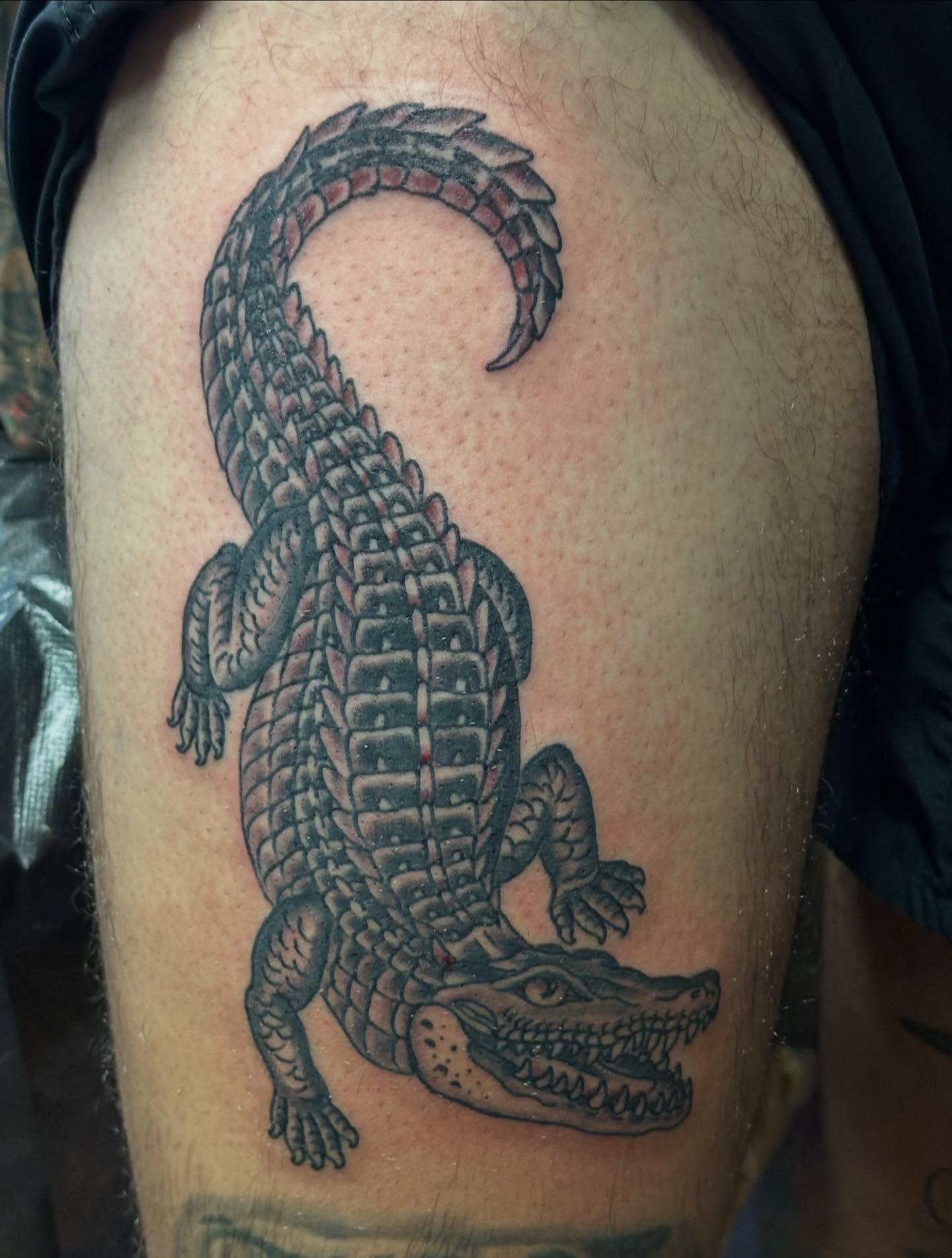 Alligator black and grey tattoo on the thigh by Jordan Rubin, Dunedin, Florida