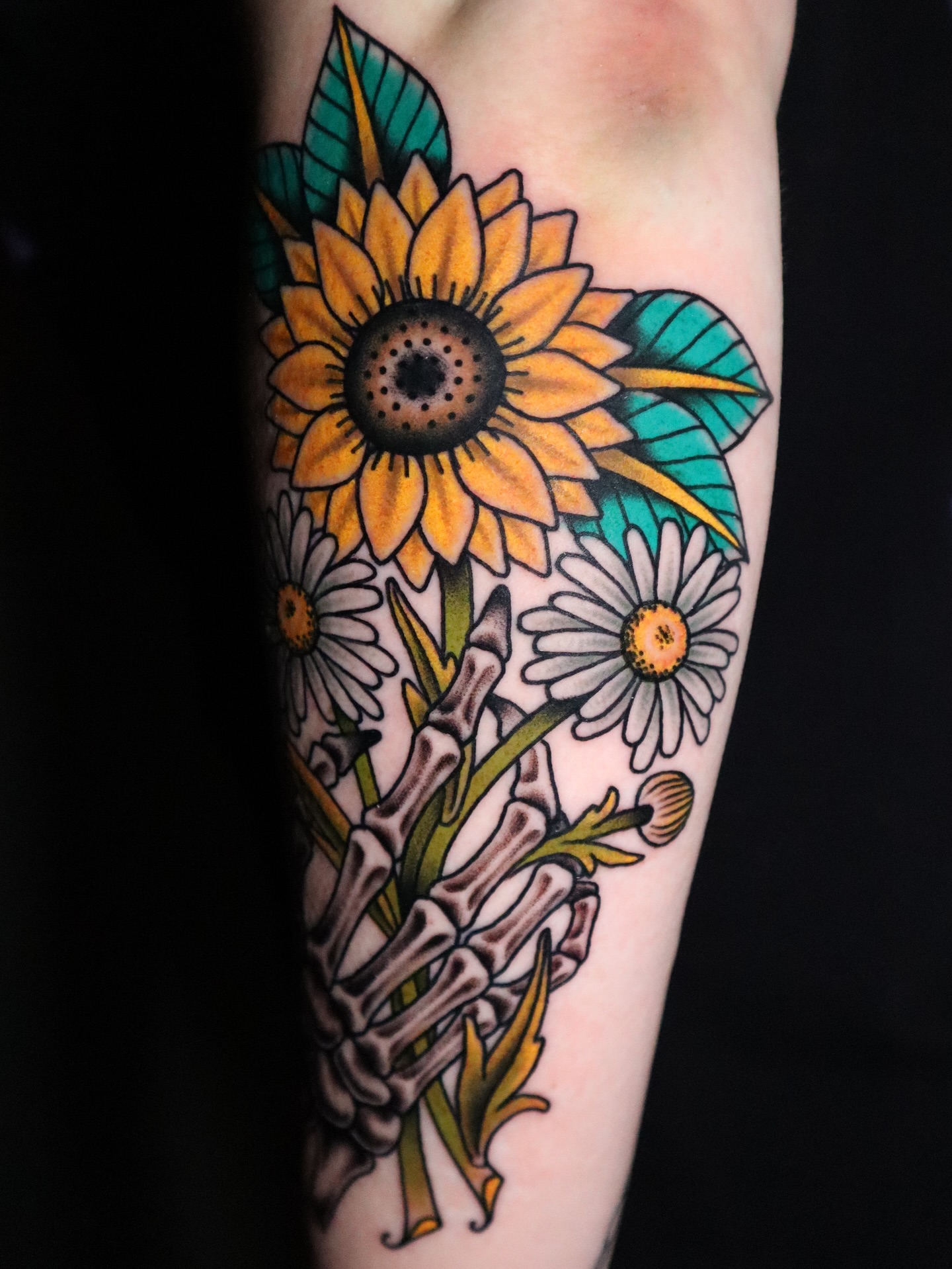 Sunflower and daisies American traditional tattoo on the forearm by Lauren Howard Tattoos