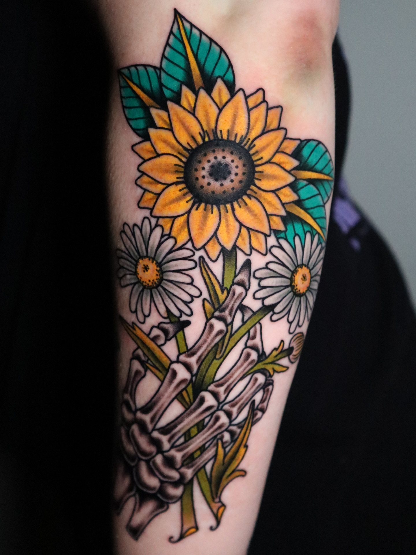 Sunflower bouquet American traditional tattoo on the forearm by Lauren Howard Tattoos