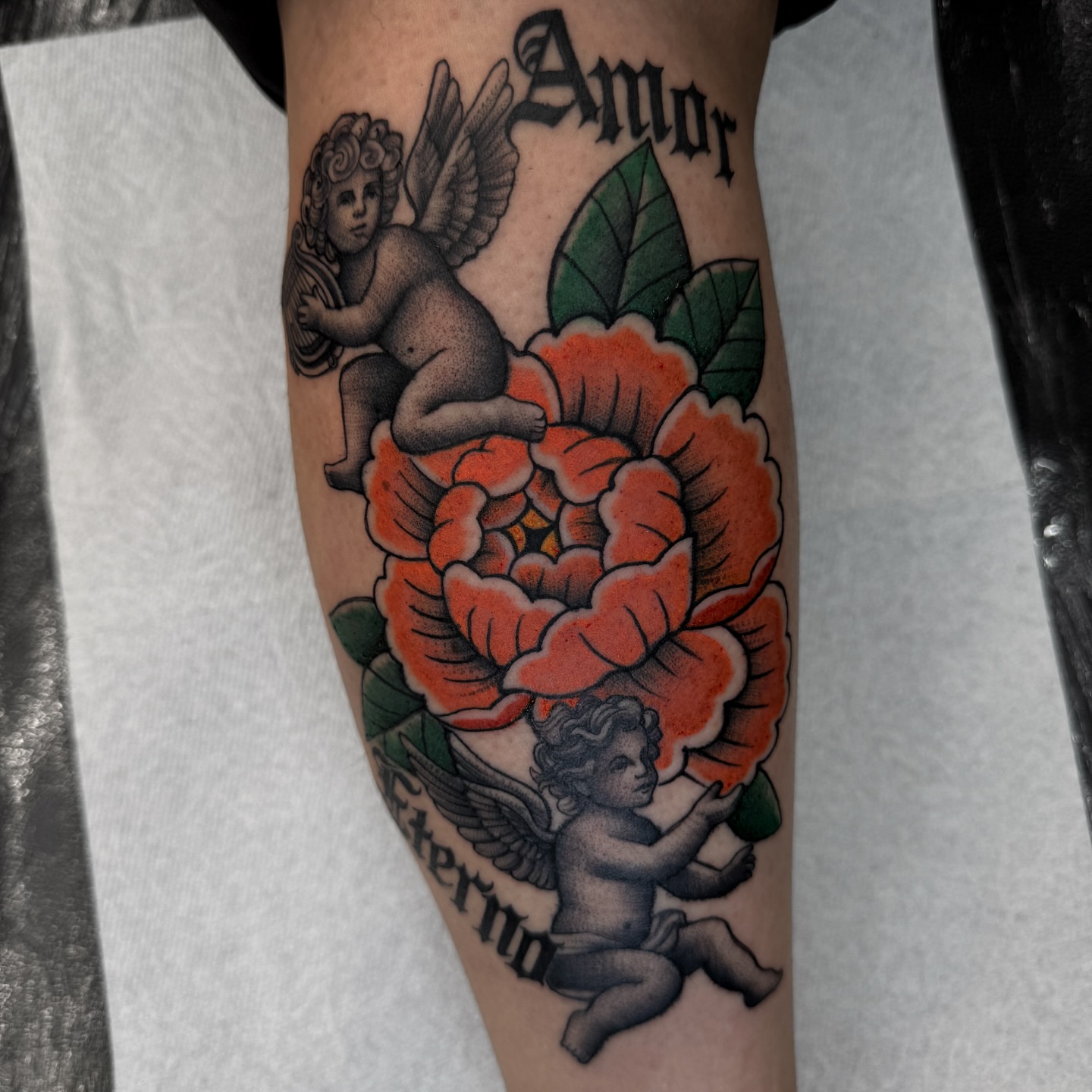 Cherubs and flower American traditional tattoo on the forearm by Gabah🌹