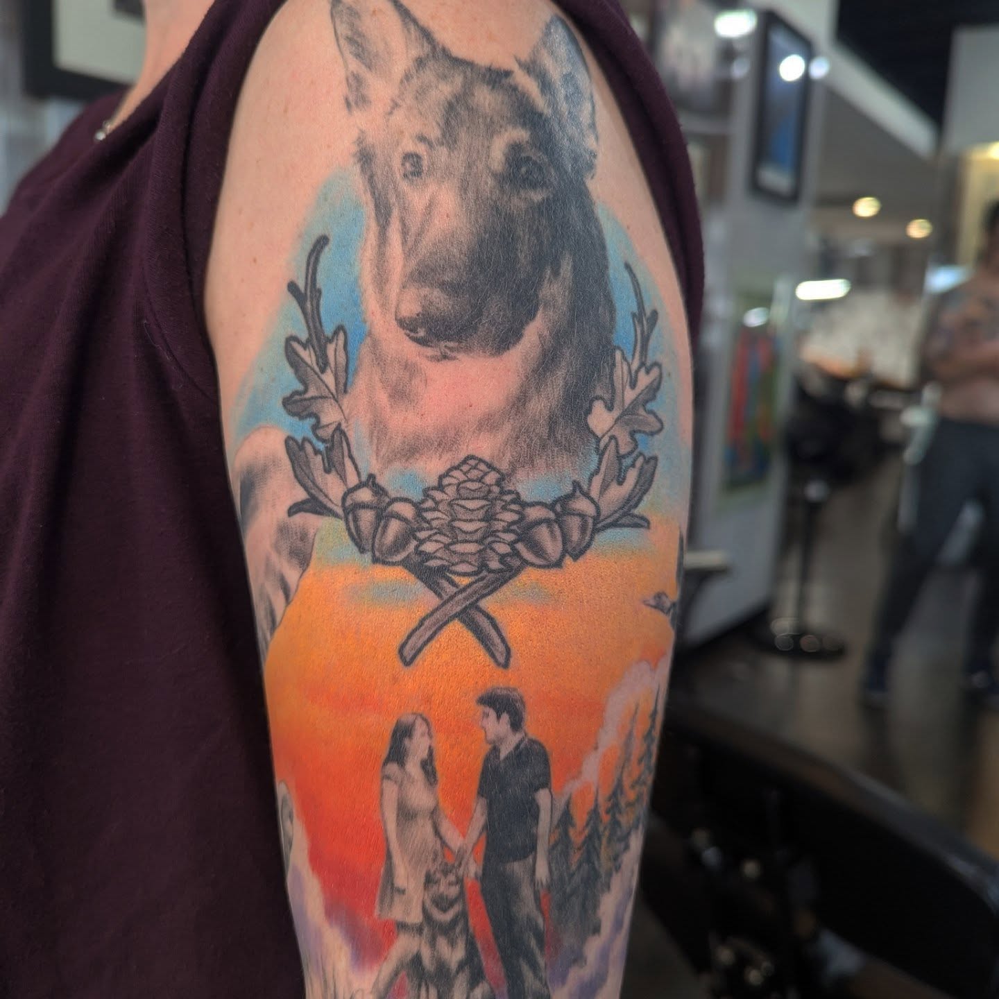 Dog and couple realism tattoo on the upper arm by Nic Skrade, Minneapolis, Minnesota
