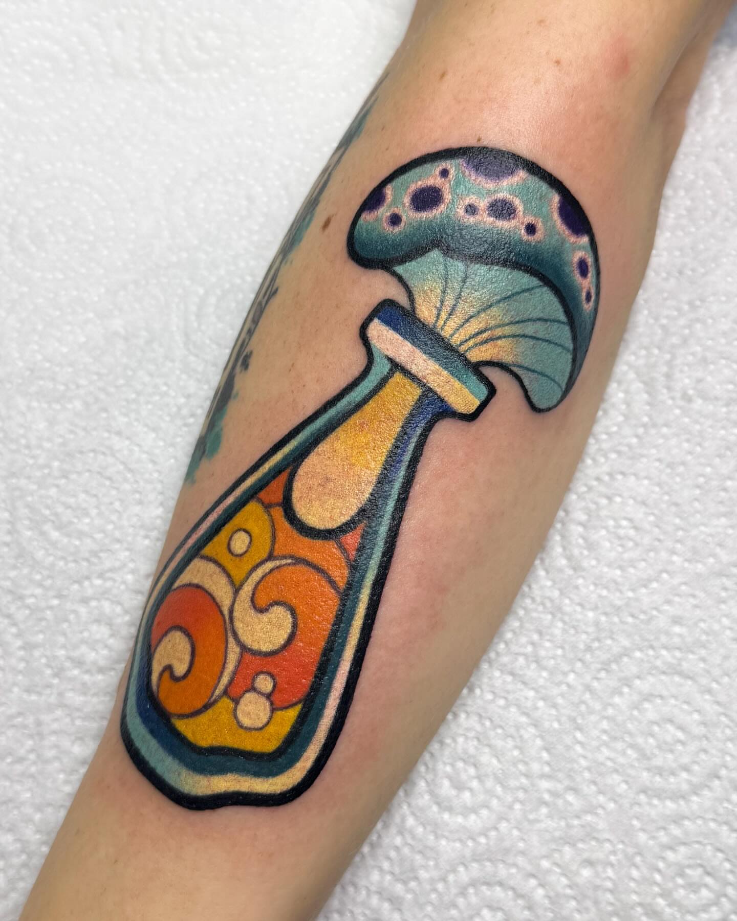 Mushroom American traditional tattoo on the forearm by Janine Ramos