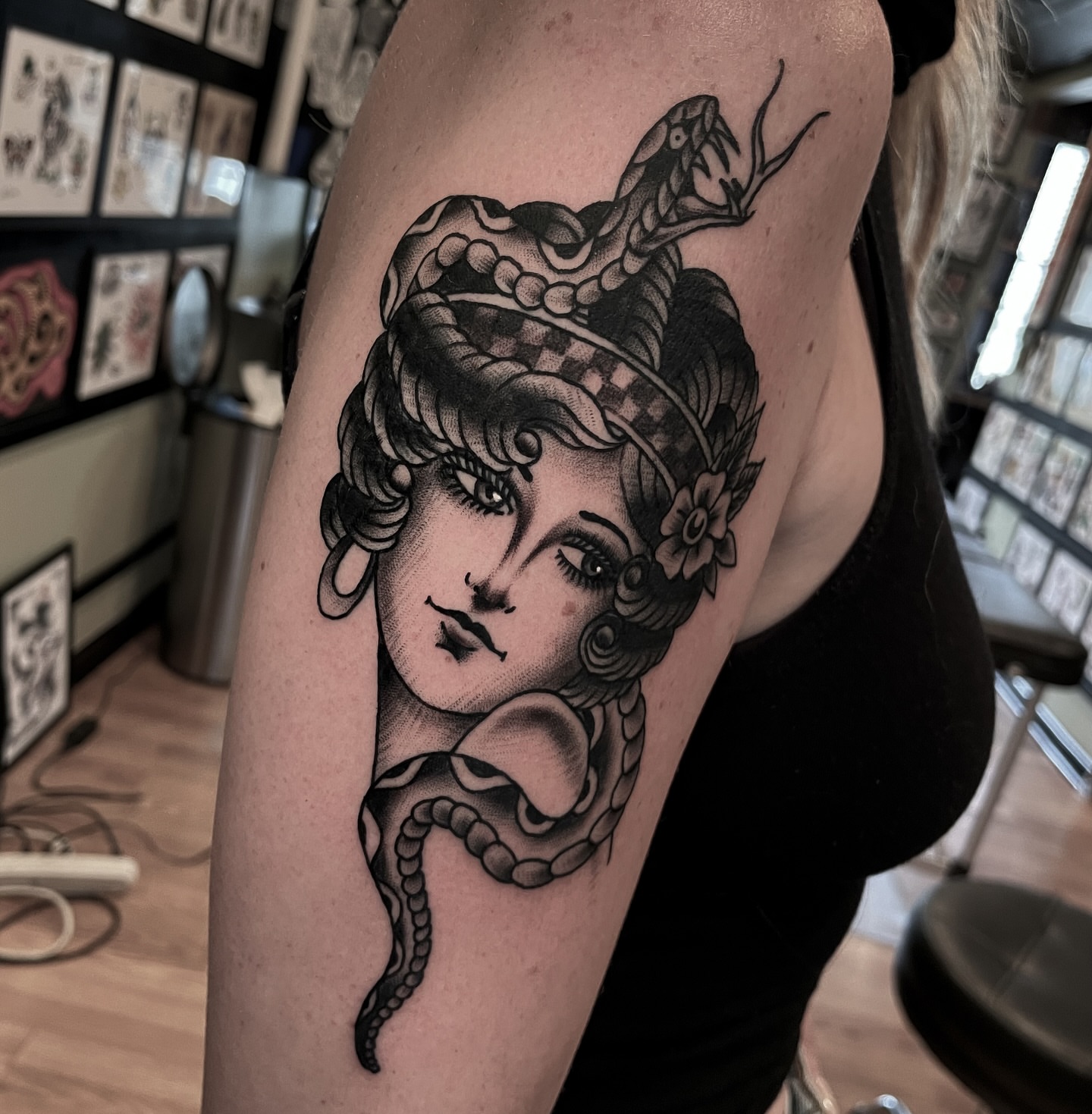 Woman with snake American traditional tattoo on the shoulder by Ian Spong