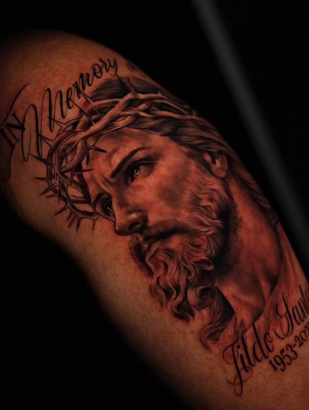 Jesus Christ portrait with lettering Chicano tattoo on the shoulder by Jennifer Garcia