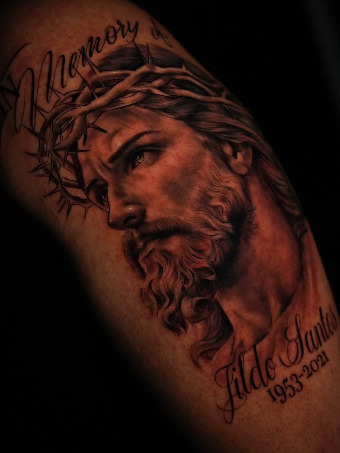 Jesus Christ portrait with lettering Chicano tattoo on the shoulder by Jennifer Garcia