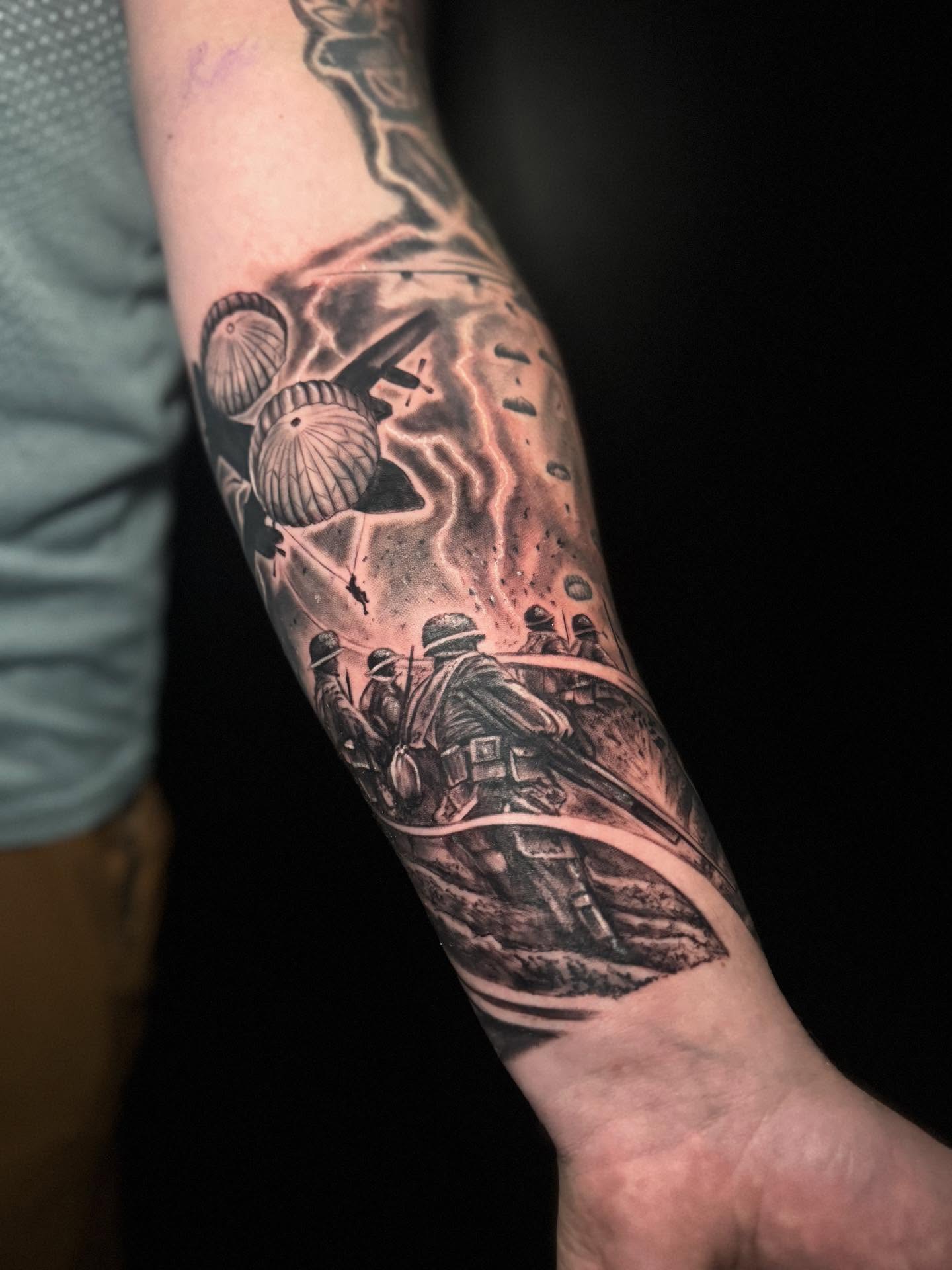 War scene realism tattoo on the forearm by Shawn Skale