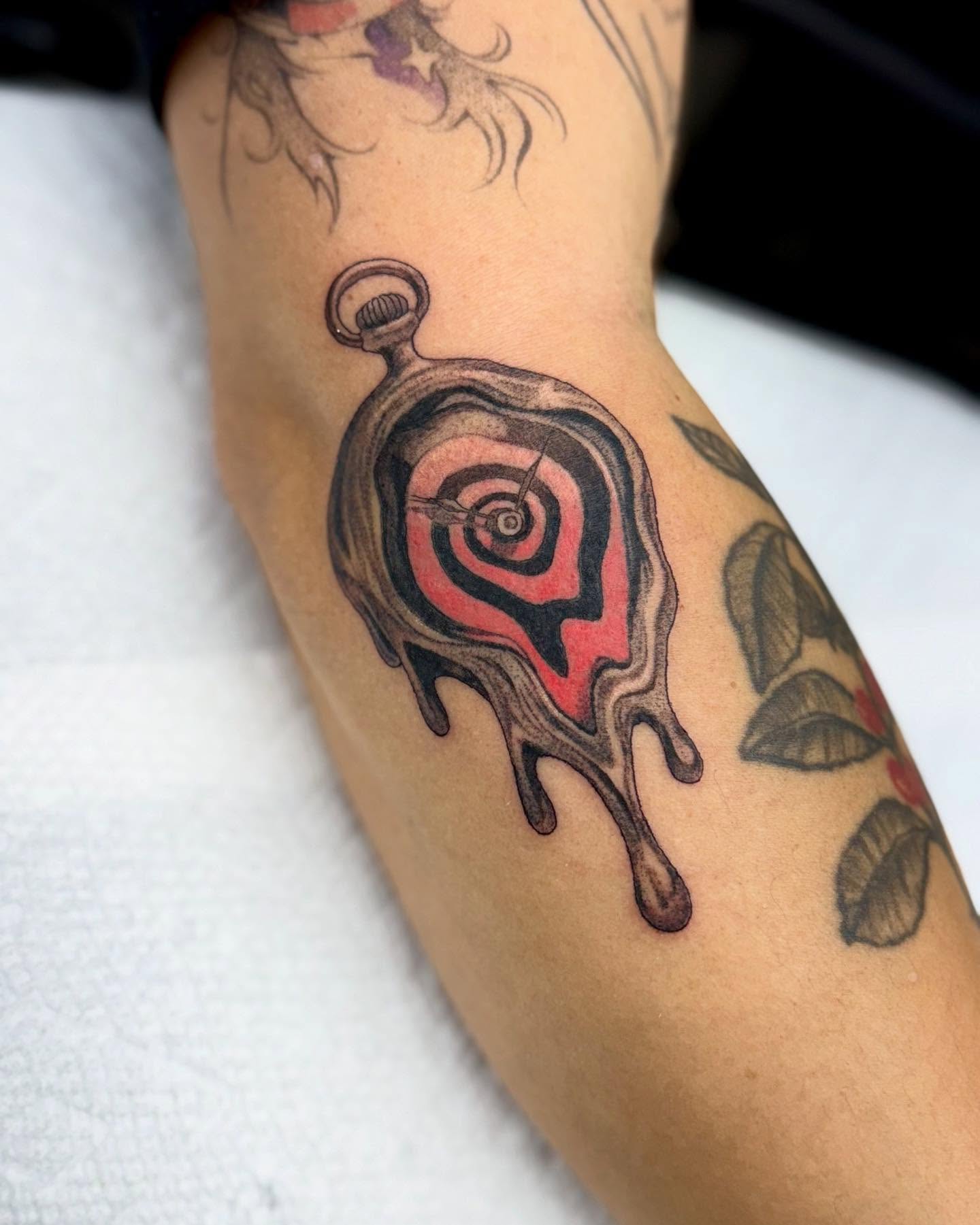 Melting pocket watch dotwork tattoo on the forearm by Erin Blaney