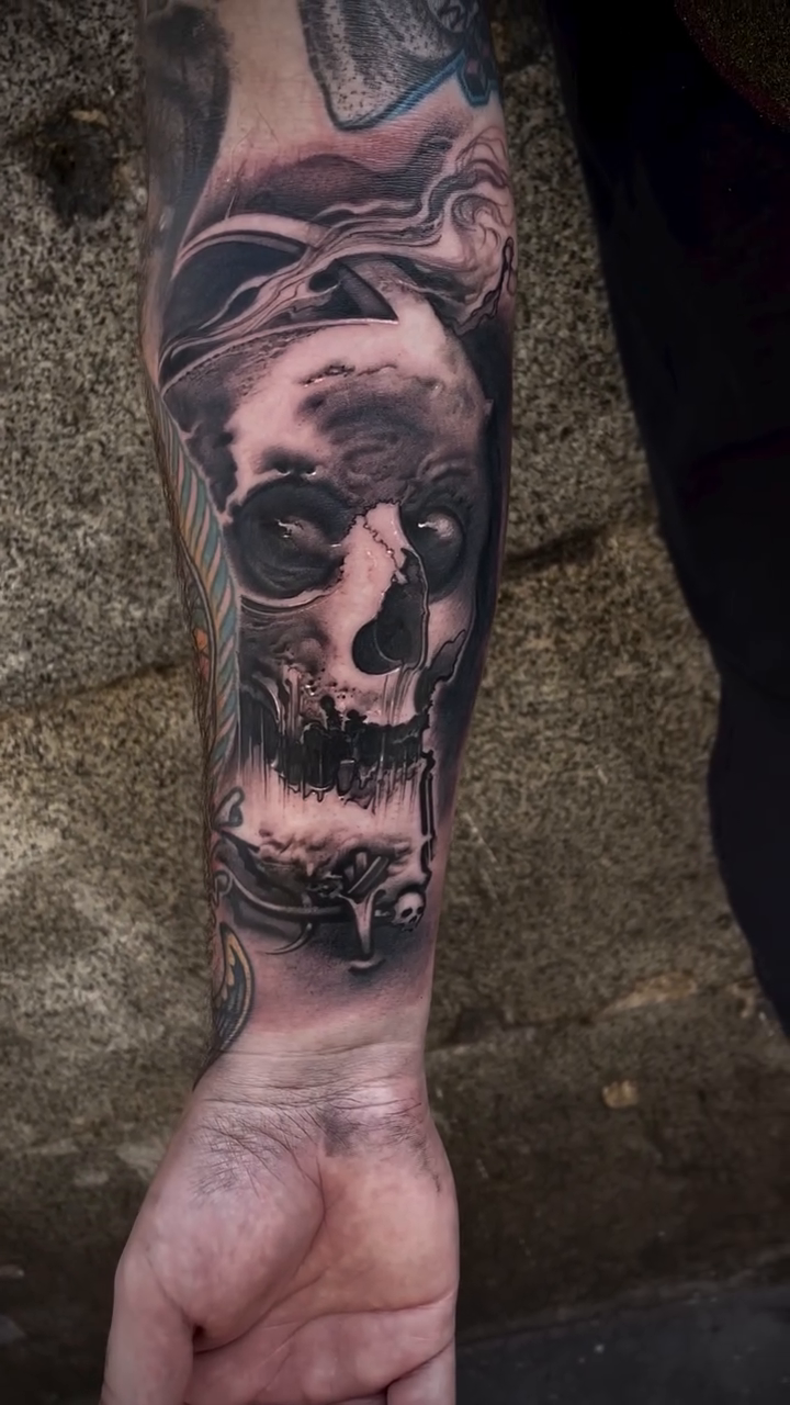 Skull with smoke realism tattoo by Robert Hernandez