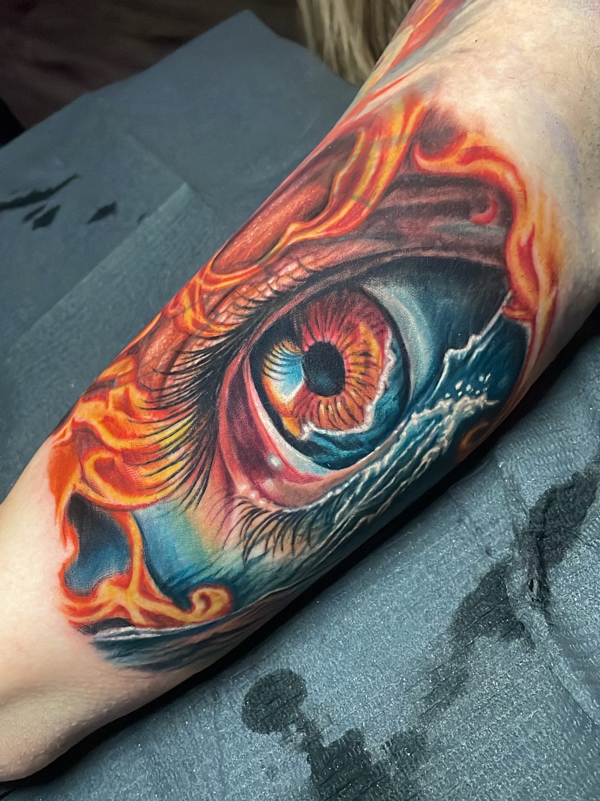 Eye realism tattoo on the forearm by Rick Elliott