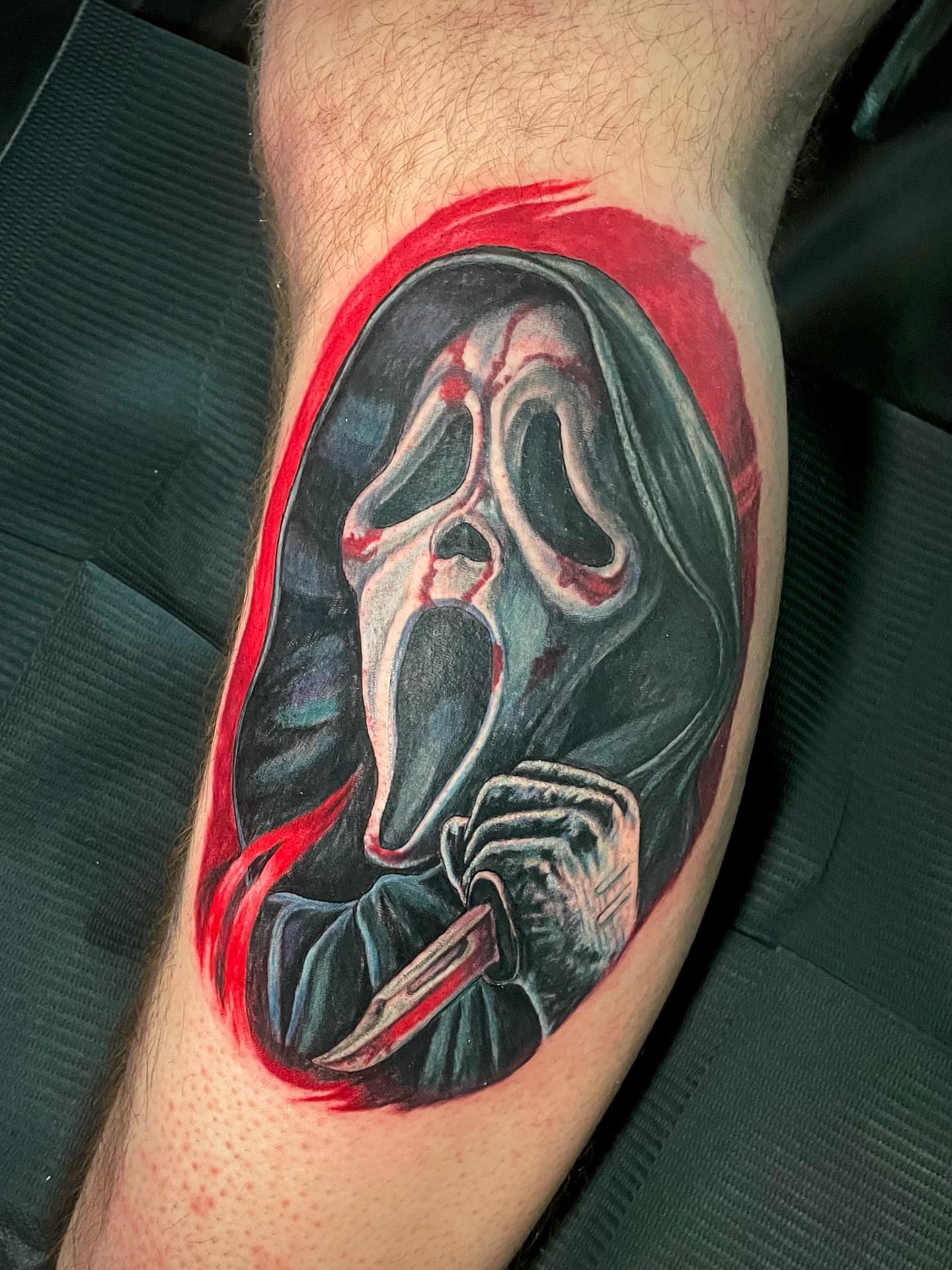 Scream mask realism tattoo on the forearm by Rick Elliott