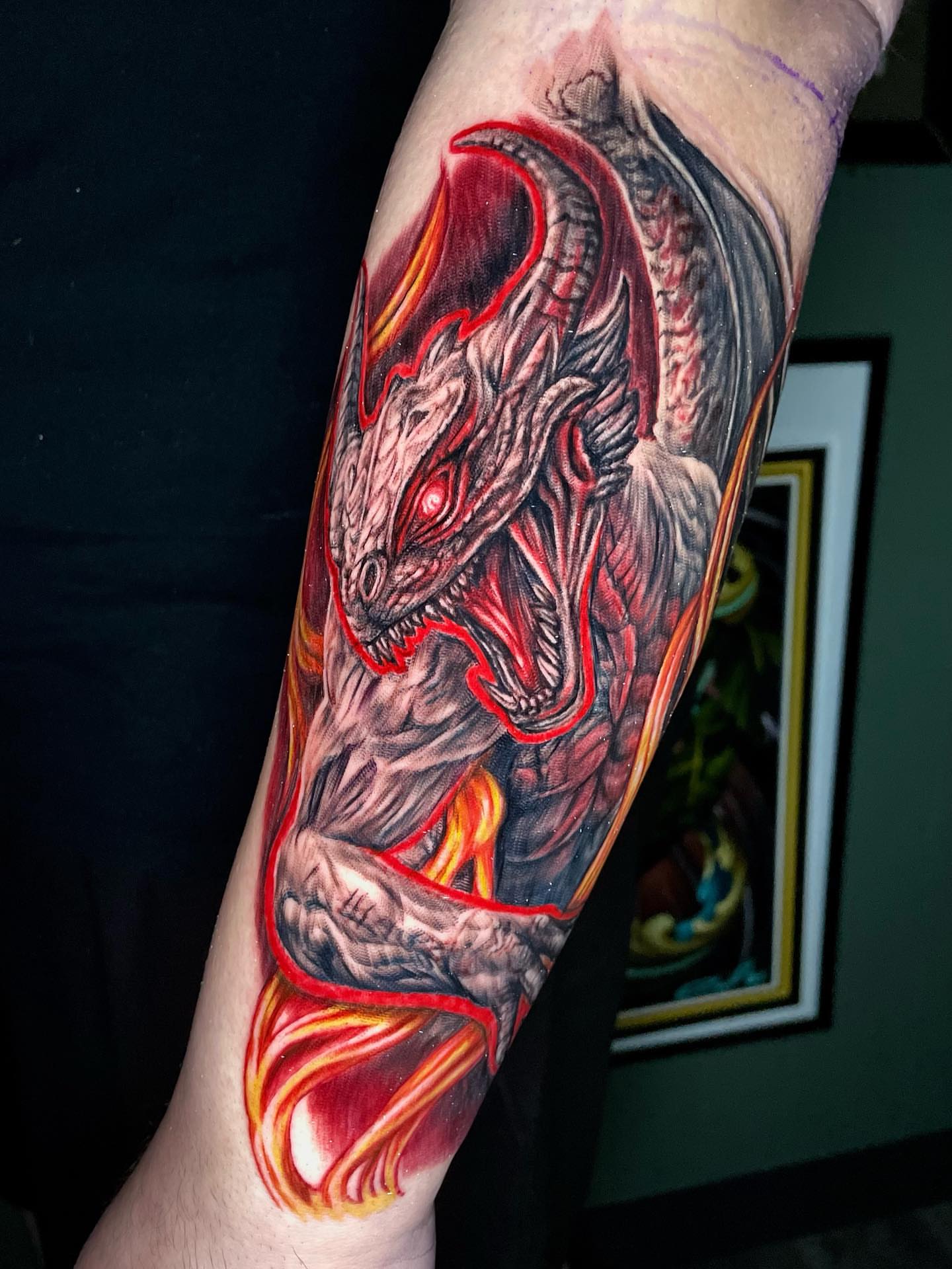 Dragon realism tattoo on the forearm by Rick Elliott