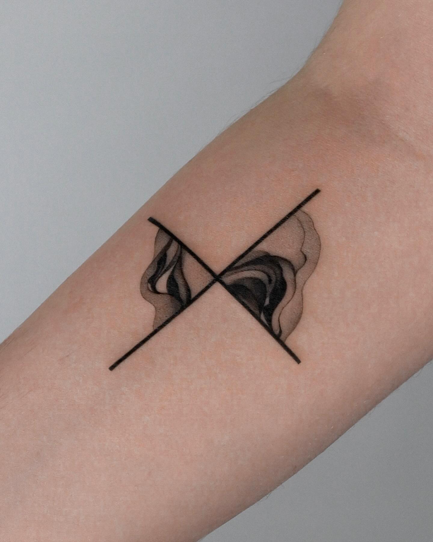 Calla lilies black and grey tattoo on the forearm by River, New York, New York