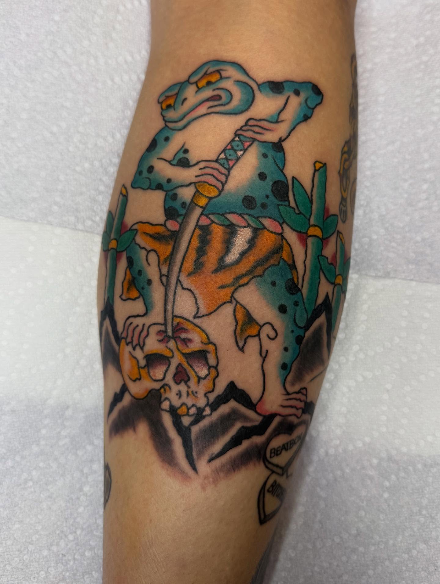 Snake and tiger American traditional tattoo on the forearm by Brendan Willbern, Austin, Texas