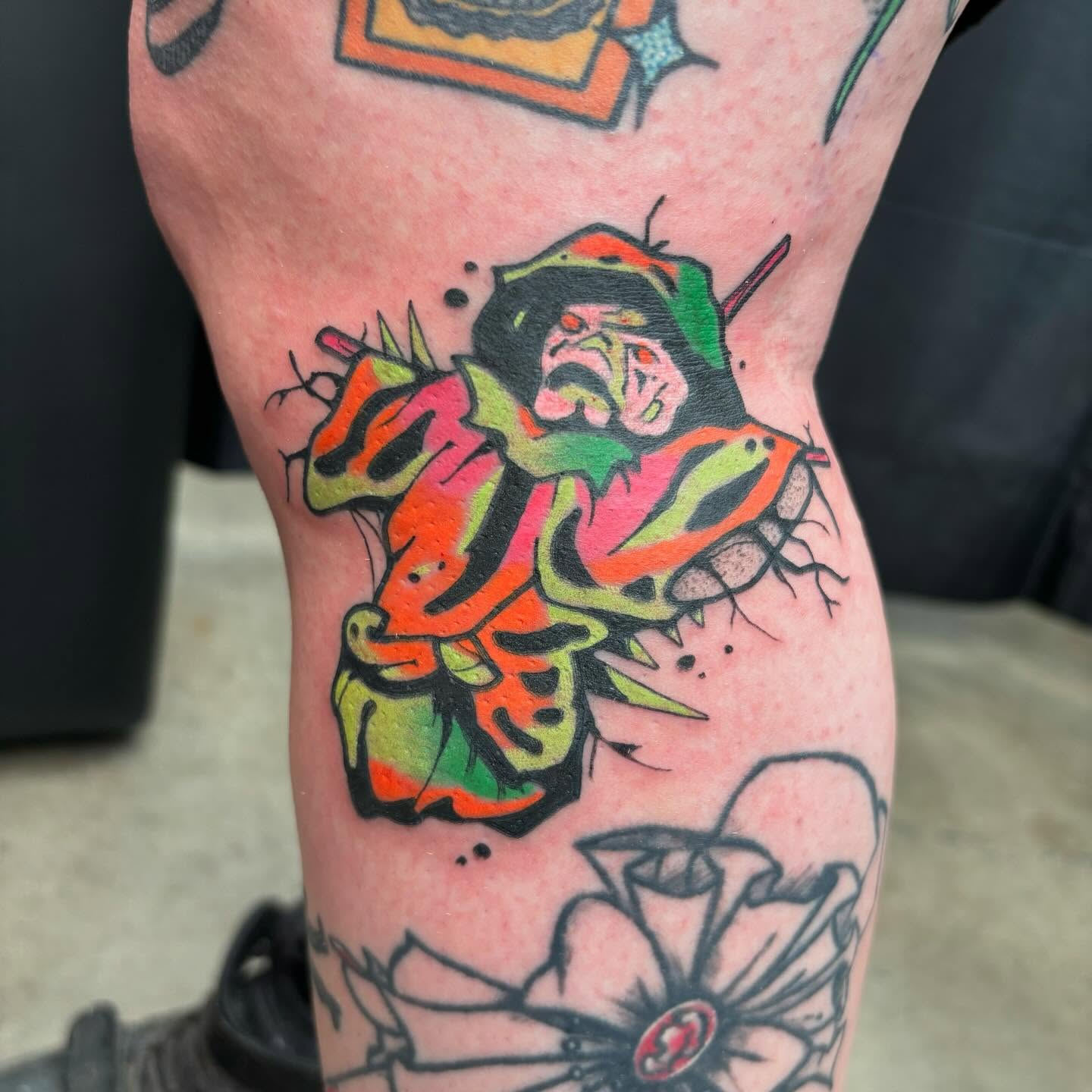 Jester American traditional tattoo on the thigh by Ghost Ham Tattoos
