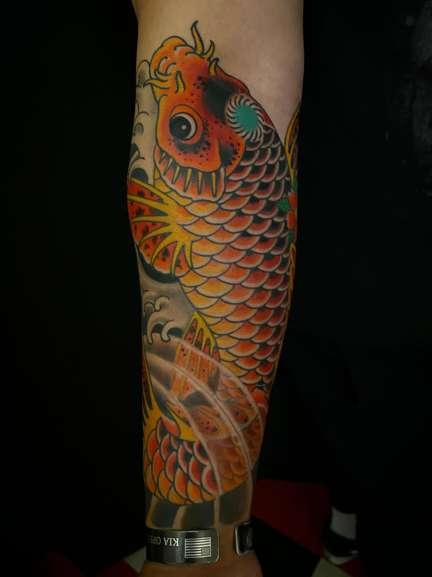 Koi fish japanese irezumi tattoo on the forearm by Adam Warmerdam, Los Angeles, California