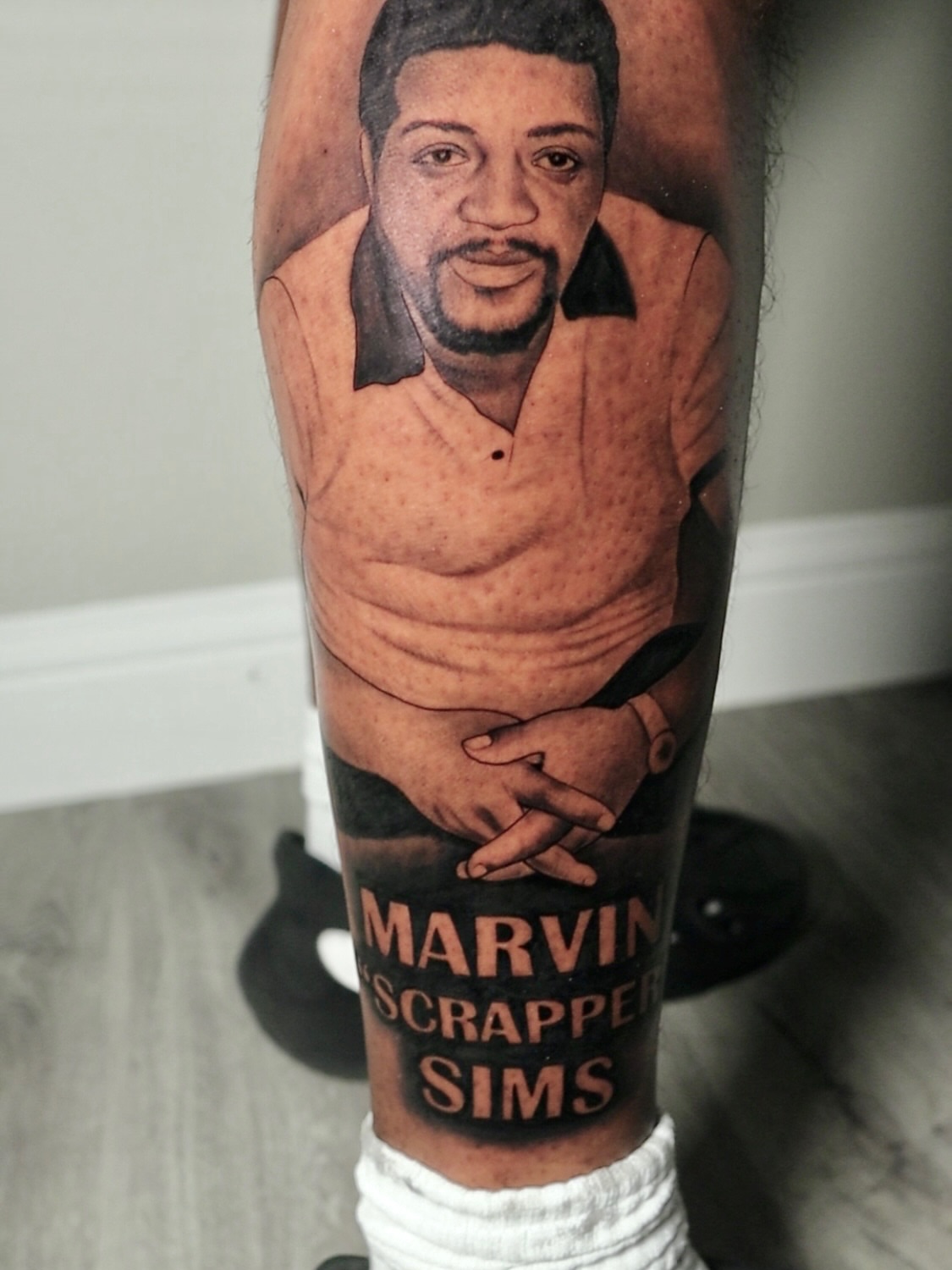 Portrait of Marvin 'Scrapper' Sims realism tattoo on the forearm by Artfabn