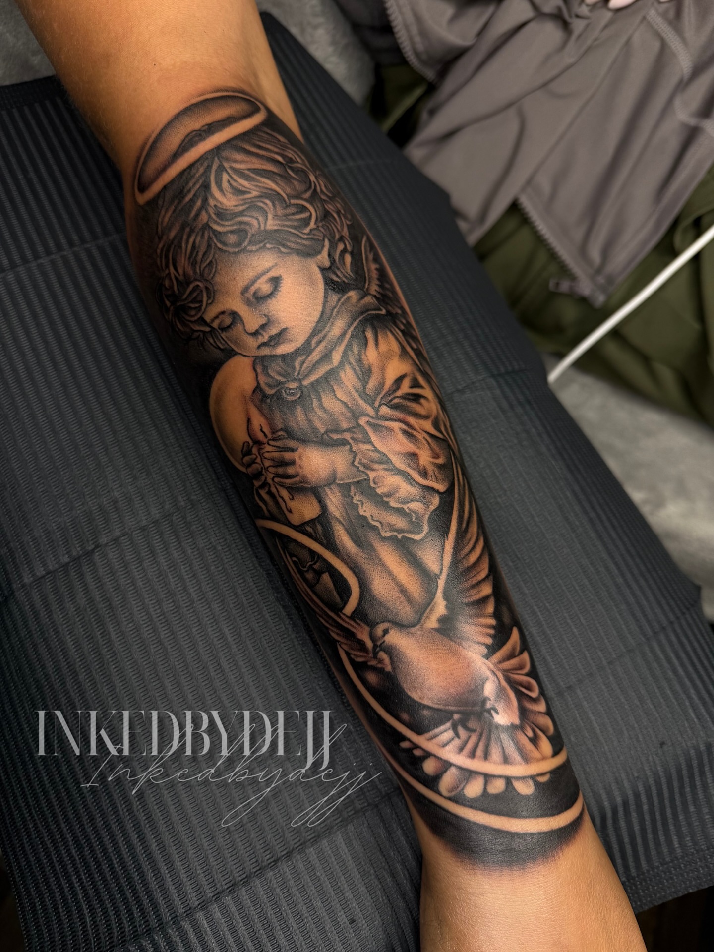 Angel realism tattoo on the forearm by Inkedbydejj