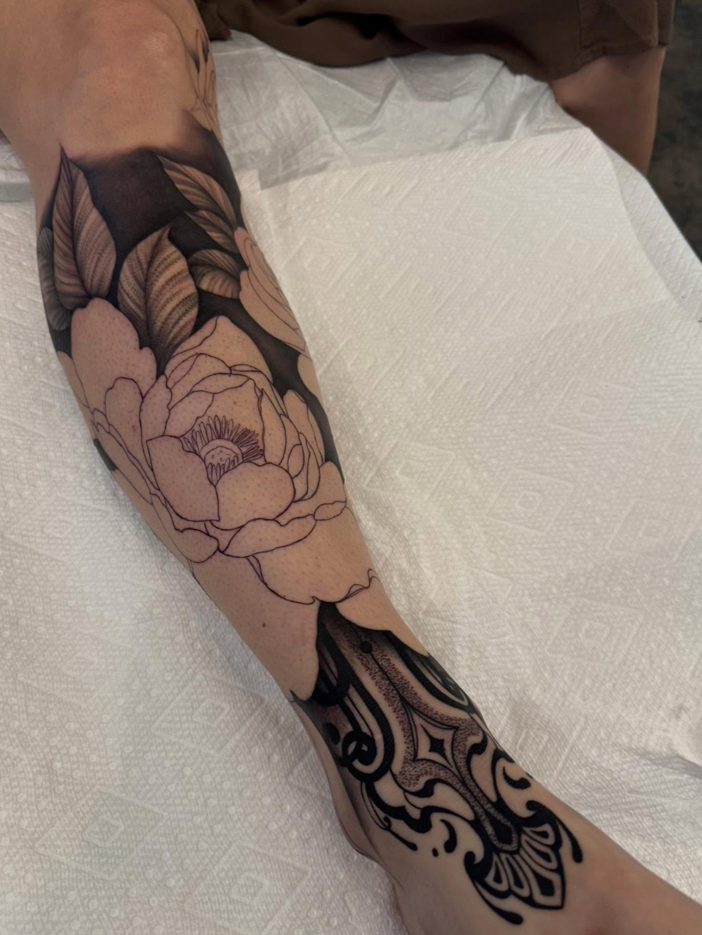Peony flower black and grey tattoo on the forearm by Sam Oakes