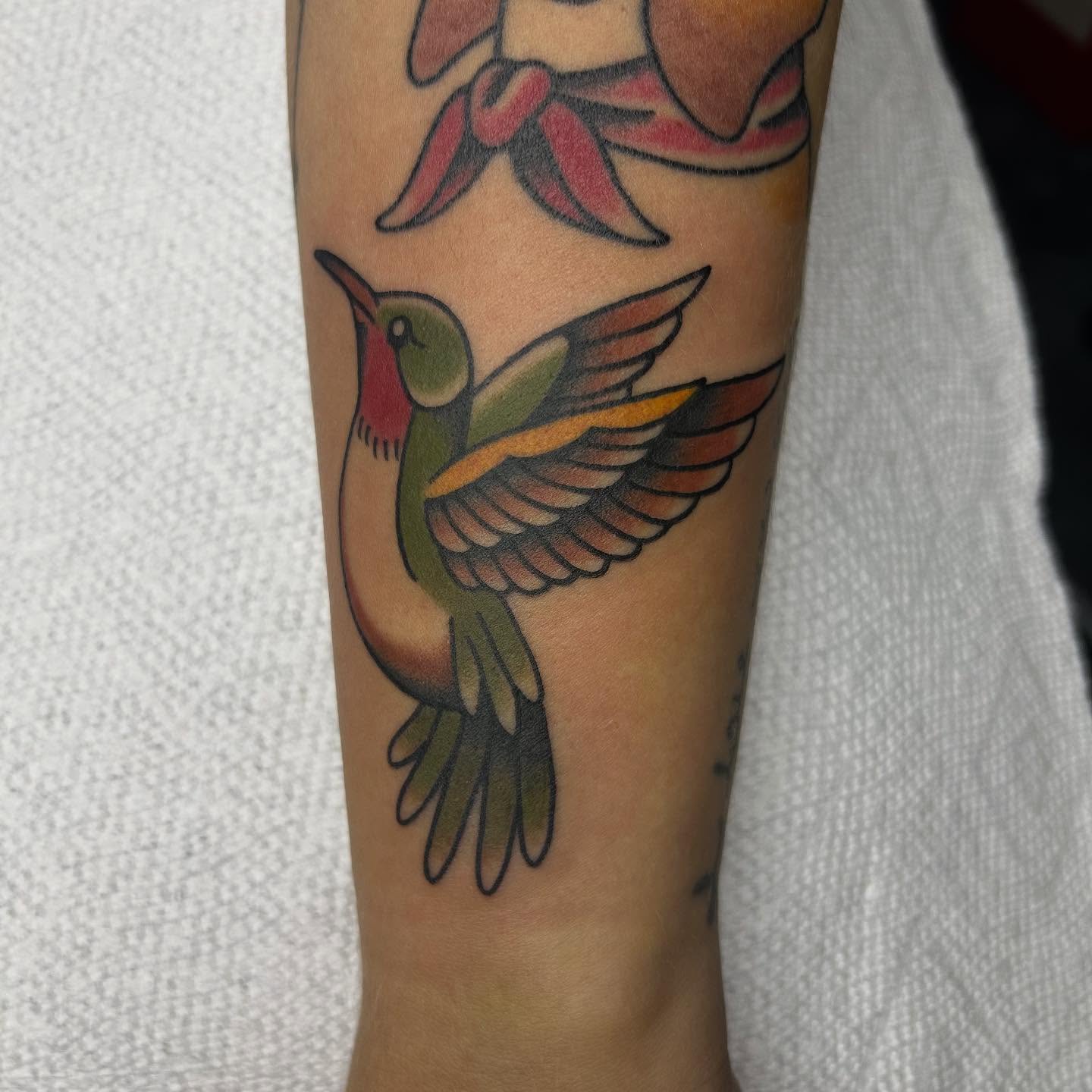 Hummingbird American traditional tattoo on the forearm by Bregan ✨