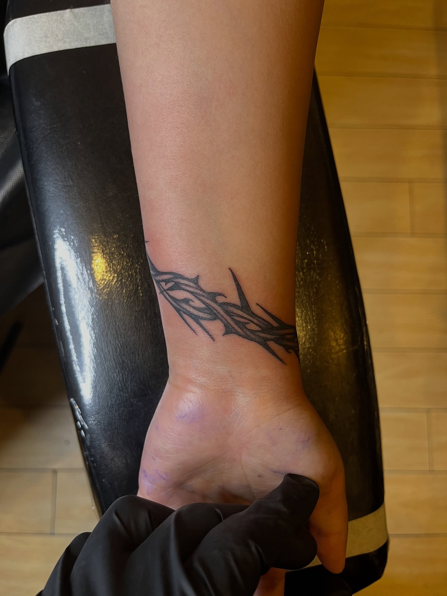 Thorn branch black and grey tattoo on the foot by Winston Thai