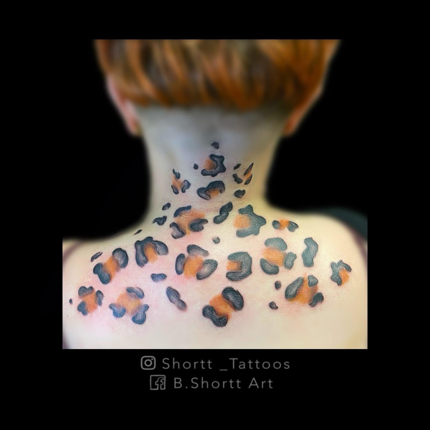Leopard print trash polka tattoo on the neck by Brie Marie