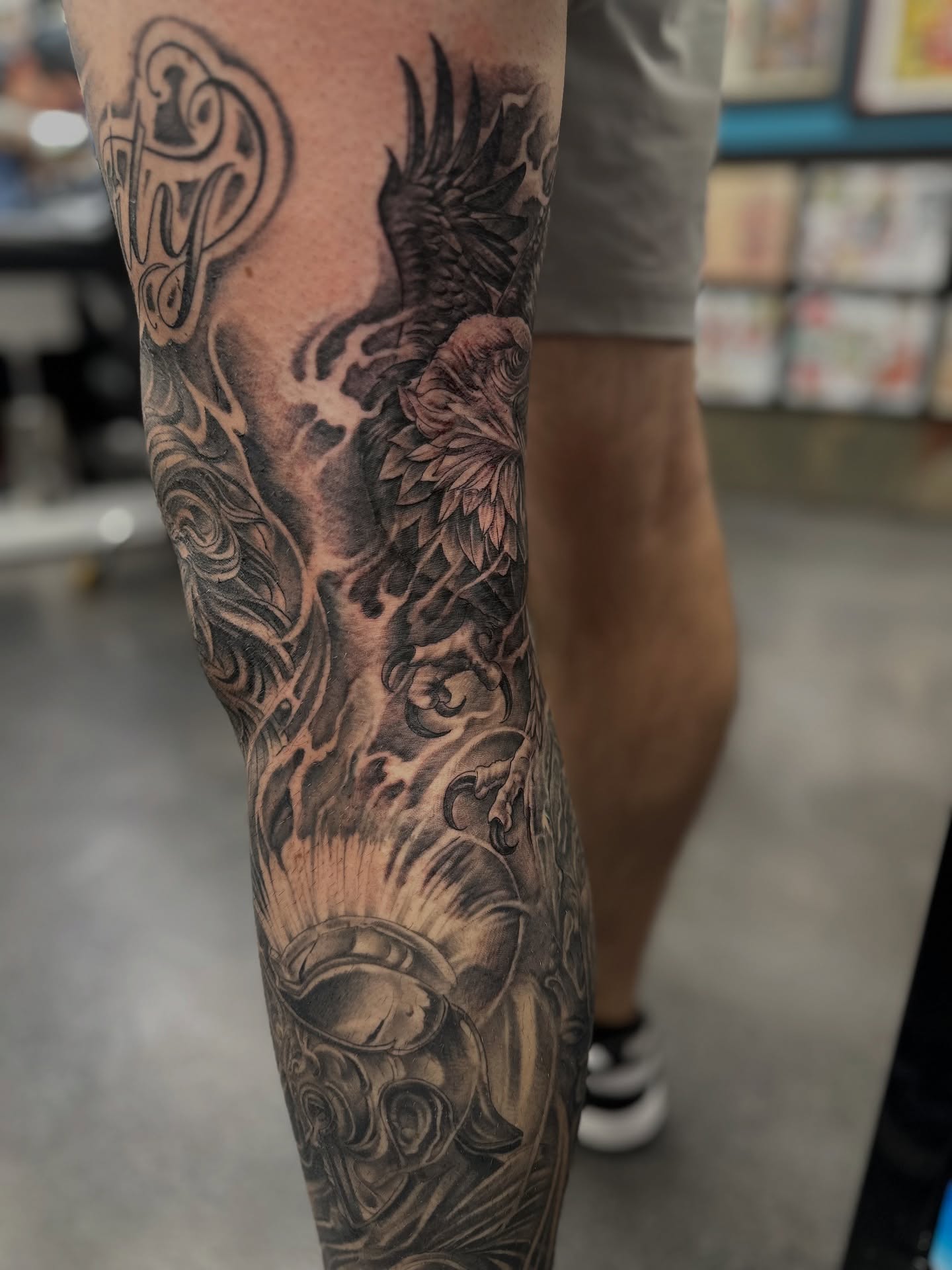 Eagle and floral realism tattoo on the forearm by Stevie O'Dell