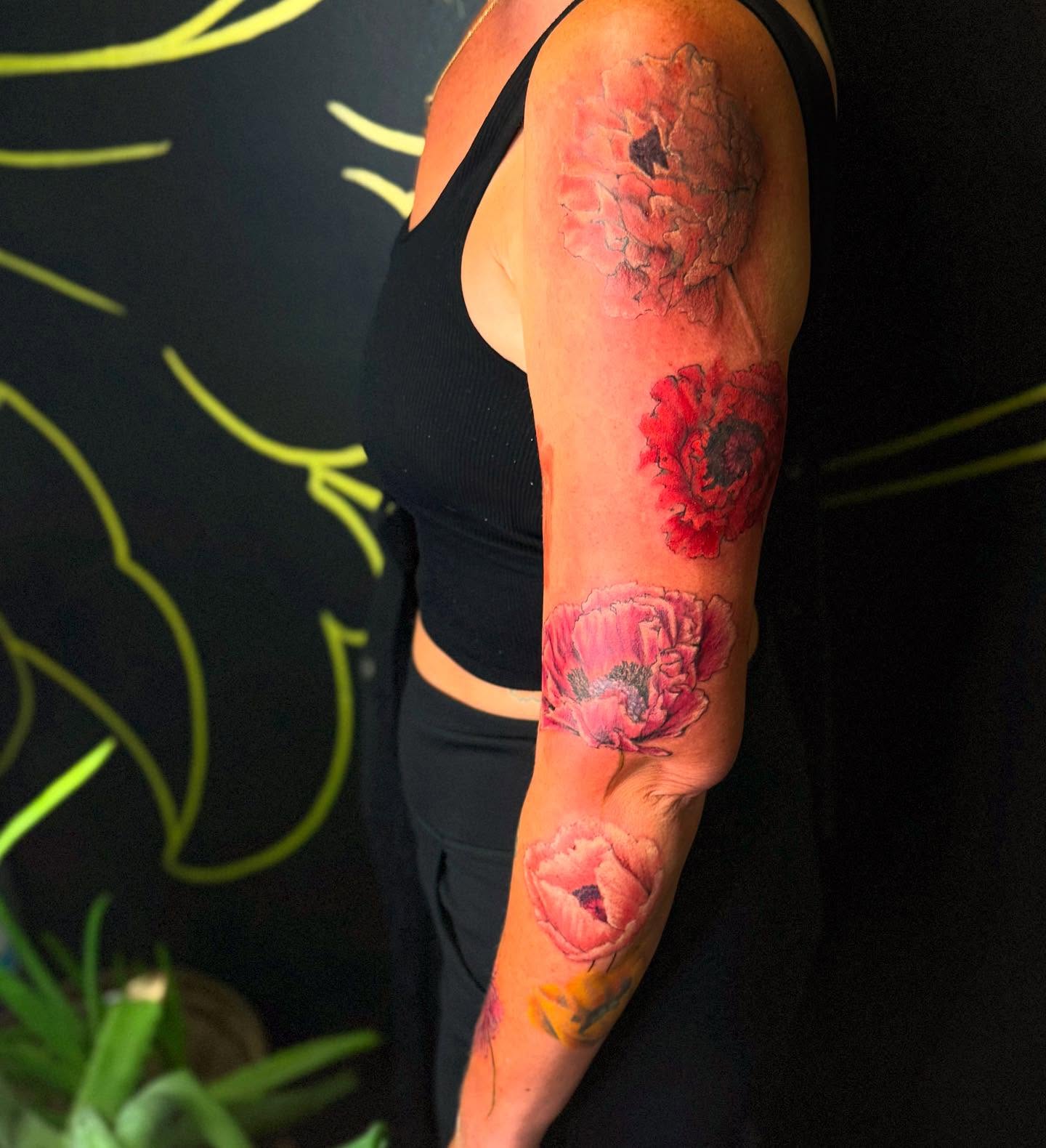 Poppy flowers watercolor tattoo on the forearm by Tattoos By Trish
