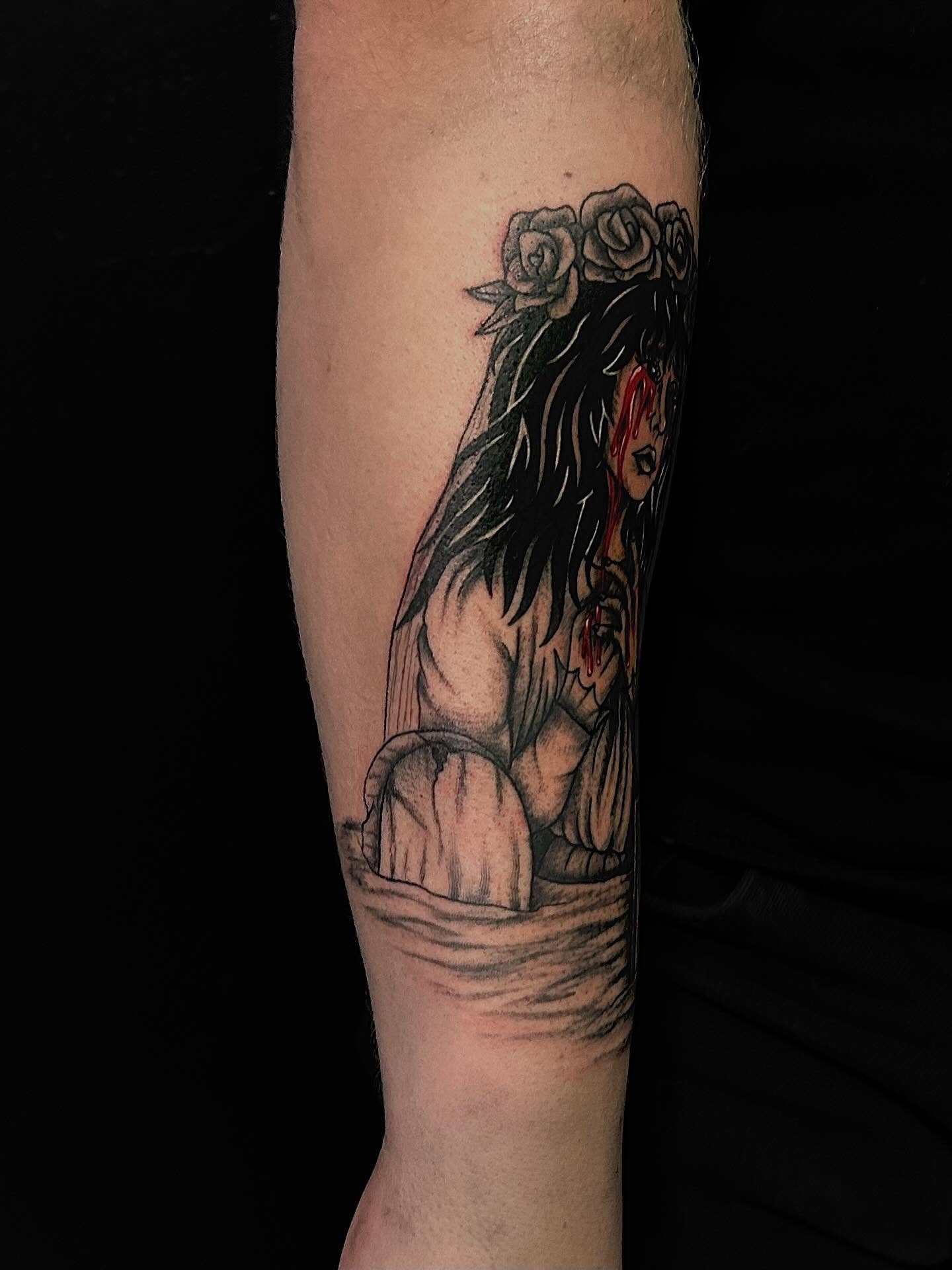Woman with roses dark realism tattoo on the forearm by Kenadee