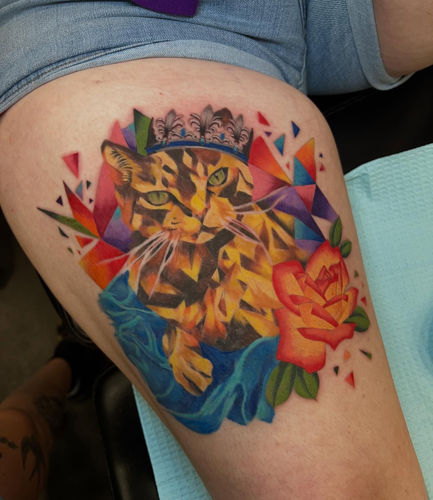Cat with crown geometric tattoo on the thigh by l y n d s e y r i c k e t t s